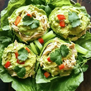 To make this creamy avocado chicken salad, gather these fresh ingredients: - 2 cups cooked chicken, shredded - 1 ripe avocado, mashed - 1/4 cup creamy Greek yogurt - 1 tablespoon Dijon mustard - 1 tablespoon lime juice, freshly squeezed - 1/4 cup red bell pepper, diced - 1/4 cup celery, chopped - 1/4 cup red onion, chopped - Salt, to taste - Freshly cracked pepper, to taste - Fresh cilantro, for garnish (optional) - Crisp lettuce leaves for serving For high-quality ingredients, look at local farmers' markets for fresh produce. You can also find organic options at grocery stores. This salad is gluten-free and keto-friendly, making it a great choice for many diets. By using rotisserie chicken, you can add more flavor and save time. Fresh lime juice enhances the taste of the avocado and adds a zesty kick. Enjoy this simple yet delightful recipe to nourish your body and satisfy your taste buds. For the full recipe, please refer to the earlier section. To start, take your ripe avocado and cut it in half. Remove the pit and scoop the flesh into a bowl. Use a fork to mash it well. Aim for a smooth texture, but don’t stress about every lump. A few chunks add character. It’s best to use avocados that are at room temperature. Cold avocados can be hard to mash smoothly. Next, grab your cooked chicken. If you have grilled chicken, it adds great flavor. Shred the chicken into bite-sized pieces. Use two forks for easy shredding. Now, add the shredded chicken to your avocado mix. Dice your red bell pepper, chop your celery, and finely chop your red onion. Add these veggies into the bowl. They add crunch and freshness. Now, it’s time to blend everything. Use a spatula to fold the ingredients gently. This keeps the texture nice, so you don’t end up with mush. After that, sprinkle in salt and freshly cracked pepper. Start with a little, mix, and taste. Adjust the seasonings until it’s just right for you. Cover your bowl with plastic wrap or use an airtight container. Place it in the fridge for about 30 minutes. Chilling helps the flavors blend. You want every bite to be a burst of taste. When it’s time to serve, use crisp lettuce leaves as your base. Spoon the creamy chicken salad generously on top. You can also serve it in a pita or as a sandwich. For a fun twist, try serving it in small bowls. Garnish with fresh cilantro for a pop of color. This makes for a beautiful dish! You can find the full recipe above. When you pick avocados, look for ones that feel slightly soft. Gently squeeze them in your palm. If they yield a little, they are ripe and ready to enjoy. If they feel firm, they need a few days to ripen. To store ripe avocados, keep them in the fridge. This slows down the ripening process and helps prevent browning. To make your creamy avocado chicken salad more exciting, consider adding a personal twist. You can mix in chopped nuts like walnuts or almonds for a crunchy texture. Diced fruits like apples or grapes can add sweetness and balance the flavors. For spices, a dash of smoked paprika or cayenne can add heat. Fresh herbs like dill or basil can brighten the dish. Experiment with these additions to find your favorite combination. One common mistake is overcooking the chicken. This can make it dry and tough. Always use cooked chicken that is tender, like grilled or rotisserie. Measuring your ingredients accurately is vital. Too much yogurt or mustard can overpower the dish. Follow the Full Recipe to keep balance. Also, avoid mashing the avocado too much. You want some texture in your salad for a delightful crunch. {{image_4}} If you want a change, you can switch the chicken for other options. For a vegetarian twist, try chickpeas or tofu. Both add protein and texture. If you want a vegan option, use jackfruit. It shreds well and takes on flavors nicely. You can also change the cheese in the salad. Try feta for a tangy bite. Or use shredded cheddar for a rich taste. Different dressings can also add flair. Swap Greek yogurt for avocado oil or tahini for a nutty flavor. To make a Mexican-inspired version, add jalapeños for heat and cilantro for freshness. This gives the salad a nice kick. You can also add corn for sweetness. For a Mediterranean twist, include olives and feta cheese. These add a salty, briny taste. Toss in some sun-dried tomatoes for extra flavor. Each variation brings a new taste and fun to the creamy avocado chicken salad. To keep your creamy avocado chicken salad fresh, use airtight containers. These containers help keep air out, which can spoil the salad. If stored correctly, the salad can last in the fridge for 2 to 3 days. However, the avocado may change color slightly, so it's best to eat it sooner rather than later. Can you freeze creamy avocado chicken salad? I don’t recommend freezing it. The texture of the avocado changes when frozen, making it mushy when thawed. If you still want to freeze it, here are some steps. 1. Prepare for Freezing: Place the salad in a freezer-safe container, leaving some space for expansion. 2. Label the Container: Write the date on the container. This way, you can track how long it’s been in the freezer. 3. Thawing Safely: When ready to eat, move the container to the fridge. Let it thaw overnight. After thawing, stir the salad gently to mix the textures back together. Remember, it may not be as creamy as fresh, but it will still taste good. To keep your avocado fresh and green, use a few simple tips. First, always mash your avocado just before mixing it into the salad. This reduces the time it is exposed to air. Next, add lime juice right after mashing. The acid in lime juice helps slow browning. If you have leftovers, store them in an airtight container. Press plastic wrap directly onto the surface of the avocado to minimize air contact. Yes, you can prepare this salad in advance. Mix all the ingredients except the avocado and lime juice. Store the chicken mixture in the fridge. When you are ready to serve, mash the avocado and stir in the lime juice. This keeps the avocado fresh and prevents browning. You can prepare it up to two days ahead for the best flavor. You can enjoy this salad in many fun ways. Serve it on toast for a tasty sandwich. You can also use lettuce cups for a fresh and crunchy bite. If you want something different, serve it as a dip with veggies or chips. Each option adds a special touch to your meal. Absolutely! This recipe is perfect for meal prep. You can make a big batch and store it in the fridge. Use airtight containers to keep it fresh. The salad stays good for up to three days. Just remember to add the avocado and lime juice right before serving. This way, you get all the fresh flavors without browning. Check the Full Recipe for more details! This blog post explains how to make a delicious avocado chicken salad. You learned about choosing quality ingredients, step-by-step instructions, and tips to elevate the flavor. We explored variations and storage methods for leftovers. Remember, the right prep makes all the difference. Keep it fun by experimenting with flavors and textures. With these tips, you can create a tasty and unique dish every time. Use this guide to impress friends and family with your cooking skills. Enjoy your next avocado chicken salad adventure!