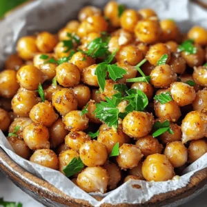 - 1 can (15 oz) chickpeas, thoroughly drained and rinsed - 1 tablespoon extra virgin olive oil - 1 teaspoon smoked paprika - 1/2 teaspoon garlic powder - 1/2 teaspoon onion powder - 1/2 teaspoon ground cumin - 1/4 teaspoon cayenne pepper (adjust for spice preference) - Sea salt, to taste - Fresh parsley, finely chopped (for garnish) I love using simple ingredients to create a tasty snack. Chickpeas are my favorite base. They pack protein and fiber, making them a smart choice. First, grab a can of chickpeas. Drain it well and rinse under cold water. This step removes excess salt and makes them cleaner. Pat them dry with paper towels. The drier they are, the crunchier they will be! Next, you'll need some olive oil. It adds flavor and helps the spices stick. Measure out one tablespoon and toss it with the chickpeas. Now let's talk spices! I use smoked paprika for a warm, smoky flavor. Garlic powder and onion powder give it a savory kick. Ground cumin adds depth, while cayenne pepper brings a subtle heat. Adjust the cayenne based on your taste. Finally, add sea salt to enhance all the flavors. You can also garnish with fresh parsley. It adds a nice color and freshness to the dish. For the full recipe, check out the details above. You'll love how easy it is to whip up these crispy air fryer chickpeas! - Preheat air fryer to 400°F (200°C) for roughly 5 minutes. - Drain and rinse chickpeas, then pat dry. Getting the air fryer hot is key. This step helps the chickpeas crisp up well. After preheating, drain a can of chickpeas. Rinse them under cold water to wash off the canned taste. Next, pat them dry with paper towels. This step is vital for achieving that perfect crunch. If you want, you can remove any loose skins for extra crispiness. - Combine chickpeas with olive oil and spices in a bowl. - Spread chickpeas in a single layer in the air fryer basket. Now it’s time to season! In a medium bowl, mix the chickpeas with olive oil and your favorite spices. For this recipe, I use smoked paprika, garlic powder, onion powder, ground cumin, and cayenne pepper. Stir until each chickpea is well-coated. Then, spread the seasoned chickpeas in a single layer in the air fryer basket. Make sure they aren’t crowded. This allows hot air to circulate, ensuring even cooking. - Air fry for 15 to 18 minutes, shaking the basket halfway through. - Allow cooling for a few minutes before serving. Set the timer for 15 to 18 minutes. Halfway through, shake the basket to help the chickpeas cook evenly. Look for a golden brown color and a nice crunch. Once done, remove the chickpeas from the air fryer. Let them cool for a few minutes. This cooling time helps them get even crunchier. Now they’re ready to enjoy! You can use them as a snack or a crunchy topping for salads. Don't forget to check the full recipe for detailed steps! To make your chickpeas super crunchy, pat them dry well after rinsing. This step helps remove any excess moisture. When you place them in the air fryer, shake the basket halfway through cooking. This move ensures even cooking on all sides. Feel free to get creative with your spices! You can try different herbs like rosemary or even curry powder for a fun twist. If you want a cheesy flavor, add a sprinkle of cheese right before serving. For a charming look, serve your crispy chickpeas in small bowls lined with parchment paper. If you like to show off their crunchiness, use clear glass containers. Both options make your snack look appealing and ready to enjoy. {{image_4}} I love to play with flavors when making crispy air fryer chickpeas. Here are two tasty ideas: - Spicy BBQ Chickpeas: Add BBQ seasoning for a smoky flavor. This mix gives the chickpeas a sweet and spicy kick. - Mediterranean: Incorporate herbs like oregano and thyme for an aromatic twist. This version is fresh and full of flavor. These crispy chickpeas are versatile and fun to eat. Here are some ways to enjoy them: - Use as a crunchy topping on salads or grain bowls. They add great texture and taste. - Enjoy as a nutritious standalone snack. They are perfect for munching while watching TV. This recipe is both gluten-free and vegan-friendly. You can adapt it further: - Adjust spices to suit your taste or dietary needs. If you want more heat, add more cayenne. If you prefer milder flavors, skip the spicy ingredients. Remember to check out the Full Recipe for more details! Store your crispy air fryer chickpeas in an airtight container at room temperature. This helps keep them crunchy and tasty. Avoid leaving them out in open air, as that makes them soggy. These chickpeas are best eaten within 3 days for the best crunch. You can put them in the fridge, but they may lose their crispiness. If you notice them getting soft, it’s time to enjoy them! If you have leftovers, you can air fry them for a few minutes to regain their crunch. Just pop them back in the air fryer at 400°F (200°C) for about 3 to 5 minutes. Avoid using the microwave. Microwaving will make them soggy and less enjoyable. - Follow the detailed steps in the recipe above. - Yes, but they require soaking and cooking first. - Try hummus, tzatziki, or a spicy yogurt dip. - Yes, they're a high-protein, low-calorie snack option! This blog post showed you how to make crispy air fryer chickpeas. We covered the key ingredients, including chickpeas and spices. You learned step-by-step instructions for preparation and cooking. Tips for perfect crunch and variations for flavor make it easy to adapt. Storing options ensure they stay fresh, and I answered commonly asked questions. Enjoy experimenting with this tasty snack. The options are endless. You can make it your own!