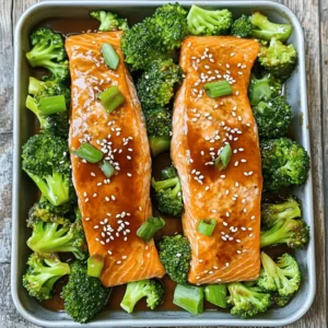 - 2 salmon fillets, skin-on - 1 cup broccoli florets - 1 tablespoon olive oil, plus extra for sautéing - Salt and pepper to taste - 1/4 cup low-sodium soy sauce - 2 tablespoons honey - 1 tablespoon rice vinegar - 1 teaspoon freshly grated ginger - 2 cloves garlic, minced - Sesame seeds for garnish - 2 green onions, thinly sliced Measuring ingredients is key in cooking. Accurate measuring helps keep flavors balanced. Too much or too little can change the dish. Before you start, gather your tools. A set of measuring cups and spoons will work best. For liquids, a liquid measuring cup is great. Use a kitchen scale for precision with solid ingredients, like salmon. Fresh ingredients often taste better and have more nutrients. Fresh salmon has a rich flavor and firm texture. Fresh broccoli adds a lovely crunch and bright color. However, frozen ingredients can be just as good. Use frozen salmon if you can’t find fresh. It’s often frozen right after catch. For broccoli, frozen options are pre-blanched, making them easy to cook. Just remember to check the package for added sauces or seasonings. In many cases, your choice depends on what you have on hand and your schedule. To make the marinade, gather these ingredients: - 1/4 cup low-sodium soy sauce - 2 tablespoons honey - 1 tablespoon rice vinegar - 1 teaspoon freshly grated ginger - 2 cloves garlic, minced Combine them in a bowl. Whisk until smooth. The goal is full flavor in every bite. A good whisk will mix everything well. If you see lumps, keep whisking. A smooth mix helps the salmon soak in the flavors. Place your salmon fillets in the bowl with the marinade. Make sure they get coated on all sides. I suggest marinating for at least 30 minutes. This time helps the flavors sink into the fish. If you have more time, marinate for a few hours. Just avoid letting it sit too long, as it can break down the fish's texture. You can choose to sear or bake the salmon. Searing gives a nice crispy skin. Bake for a softer finish. I prefer starting with a sear. Heat a tablespoon of olive oil in an oven-safe skillet. Once the oil is hot, place the salmon skin-side down. Cook for about 4 minutes. The skin should turn golden and crispy. After searing, brush some marinade over the fish. Then transfer the skillet to a preheated oven at 400°F (200°C). Bake for 8-10 minutes. Check for doneness by gently flaking the fish with a fork. It should flake easily and look opaque. This method ensures your salmon stays juicy and tender. For the broccoli, blanch it before sautéing. This keeps the bright color and crunch. Enjoy this flavorful and healthy dish, Teriyaki Salmon with Broccoli, as part of your meal plan. For the full recipe, check out the section above. To check for doneness, use a fork. Gently flake the salmon. If it flakes easily, it’s done. Aim for a slightly moist center for best taste. For crispy skin, start with a hot pan. Place the salmon skin-side down and don’t move it too much. This helps to get a nice crisp. Blanching is quick and easy. Boil salted water and add your broccoli for just 2-3 minutes. Then, move it to ice water right away. This keeps the bright green color and crunch. To enhance broccoli’s flavor, sauté it with olive oil and a pinch of salt. You can also add garlic for extra taste. For an appealing look, plate the dish with care. Start with a bed of sautéed broccoli. Then, place the teriyaki salmon on top. For garnish, sprinkle sesame seeds and add sliced green onions. A slice of lemon on the side adds color and a fresh zest. For more details, check the Full Recipe for Teriyaki Salmon with Broccoli. {{image_4}} You can change the protein if you want something different. Chicken thighs or tofu work great. They soak up the teriyaki flavor well. You can also try shrimp for a seafood twist. For vegetables, broccoli is just the start. You can use asparagus or snap peas. Carrots add color and crunch too. Feel free to mix and match your favorites. To spice things up, add crushed red pepper flakes. They give the dish a nice kick. You can also try different sauces. Hoisin or sweet chili sauce can add a fun twist. Nuts or seeds are great for texture. Toasted sesame seeds bring a nutty flavor. Chopped peanuts can add crunch and richness. Try adding these to your dish for extra excitement. If you need gluten-free options, use tamari instead of soy sauce. It has a similar taste but is safe for gluten-free diets. You can also use coconut aminos. For a vegan twist, replace the salmon with firm tofu. Marinate it in the same sauce. You can also swap honey with maple syrup or agave. This keeps the flavor but meets vegan needs. For the full recipe, check out the Teriyaki Salmon Glow-Up! To keep your teriyaki salmon and broccoli fresh, follow these best practices: - Cool Down: Let the food cool to room temperature first. - Use Airtight Containers: Store leftovers in airtight containers. This keeps moisture in and air out. - Label and Date: Write the date on the container. This helps you track how long it stays fresh. Refrigerate leftovers right away. They can last up to three days. Reheating salmon can be tricky. You want to keep it moist and tasty. Here are some methods: - Oven: Preheat your oven to 275°F. Place the salmon on a baking dish with a little water. Cover it with foil to keep it from drying out. Heat for 15-20 minutes. - Microwave: Use a microwave-safe plate and cover the salmon with a damp paper towel. Heat in short bursts of 30 seconds. Check often to avoid overcooking. These methods help maintain the nice texture and flavor of the salmon. If you have extra teriyaki salmon, it freezes well. Here’s how to do it: - Wrap Well: Use plastic wrap or aluminum foil to wrap the salmon tightly. This prevents freezer burn. - Use Freezer Bags: Place the wrapped salmon into a freezer bag. Squeeze out the air before sealing. To thaw, place the salmon in the fridge overnight. For quick thawing, seal it in a bag and submerge in cold water for about an hour. This way, you can enjoy your teriyaki salmon later without losing its great taste. For the full recipe, check the complete cooking guide. You can serve this dish with various sides. Here are some tasty options: - Steamed rice: White or brown rice works well. The rice soaks up the teriyaki sauce. - Quinoa: This grain adds a nutty flavor. It’s also a healthy choice. - Edamame: These young soybeans add color and protein to your meal. - Cauliflower rice: A great low-carb option that pairs nicely with the salmon. - Cucumber salad: A fresh, crunchy side that complements the rich teriyaki flavor. These sides enhance the meal and balance the flavors of the dish. Teriyaki salmon can last in the fridge for up to three days. Store it in an airtight container. Check for signs of spoilage to ensure safety: - Smell: If it has a sour or off odor, it’s time to toss it. - Texture: If the salmon feels slimy or sticky, do not eat it. - Color: Fresh salmon should look vibrant. If it appears dull, it's best to discard it. Following these tips will keep your meal safe and tasty. Yes, you can prepare parts of this recipe ahead of time. Here are some best practices: - Marinate the salmon: You can marinate it the night before. This lets the flavors develop fully. - Blanch the broccoli: You can blanch it in advance. Just store it in the fridge until you are ready to sauté. - Cook and reheat: If you cook the salmon ahead, store it properly. Reheat gently to keep it moist. Timing is key here. Prepare items in advance but cook the salmon close to serving time for the best results. You can find the full recipe to guide your cooking adventure. This guide offers a clear path to making teriyaki salmon with broccoli. We discussed key ingredients, the best preparation methods, and cooking techniques. Understanding fresh versus frozen items helps you choose wisely. Overall, you can create a delicious dish that impresses everyone. Remember to use accurate measurements and prepare tasty sides. Follow these steps, and you will enjoy great meals every time.