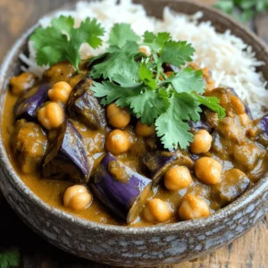 For a great eggplant and chickpea curry, you need some key ingredients. Here’s what you’ll need: - 1 large eggplant, diced into bite-sized cubes - 1 (15 oz) can of chickpeas, thoroughly drained and rinsed - 1 medium onion, finely chopped - 2 cloves garlic, minced - 1-inch piece of fresh ginger, grated These ingredients bring out the best flavors. The eggplant adds a rich texture. Chickpeas give protein and heartiness. Onions, garlic, and ginger provide a wonderful base. Spices make this dish pop with flavor. Here are the key spices you should have: - 2 tablespoons curry powder - 1 teaspoon turmeric powder - Salt and freshly cracked pepper, to taste Curry powder gives the dish its main flavor. Turmeric adds a warm color and depth. Always adjust salt and pepper based on your taste. Every curry needs a creamy base to bring it all together. Use these liquids: - 1 (14 oz) can of coconut milk - 1 cup diced tomatoes (can be fresh or canned) Coconut milk creates a rich and creamy sauce. Diced tomatoes add freshness and balance the spices. Together, they make the dish comforting and enjoyable. For the complete preparation, check out the Full Recipe. Start by heating olive oil in a large skillet over medium heat. Add the chopped onion. Sauté it until it turns soft and clear, about five minutes. Stir occasionally to prevent it from burning. Next, add the minced garlic and grated ginger. Cook this mix for one minute. You want it to smell good. Now, sprinkle in the curry powder and turmeric. Stir this for about 30 seconds. This toasts the spices and brings out their flavors. Time to add the star of the dish! Toss in the diced eggplant. Stir well to coat it with the spices. Let it cook for about five to seven minutes. Stir occasionally until it starts to soften. Next, add the diced tomatoes and coconut milk to the skillet. Gently mix in the chickpeas. Season with salt and pepper to your taste. Bring the curry to a gentle simmer. Cover the skillet and let it cook for 15 to 20 minutes. Stir it occasionally. This helps the eggplant become tender and the flavors meld together. Before serving, taste the curry. Adjust the seasoning as needed. You may want to add more salt, pepper, or spices. Let it rest for a few minutes after cooking. This helps the flavors develop more. Enjoy your flavorful and simple eggplant and chickpea curry! For the full recipe, check out the details above. To make your eggplant and chickpea curry stand out, focus on toasting spices. Toasting spices brings out their oils and deepens their flavor. Heat the spices for just a short time in the oil before adding other ingredients. This step is easy and makes a big difference. Cooking eggplant to perfection is also key. Eggplant can absorb a lot of oil, so don’t add too much at first. Cook it until it's tender but not mushy. This keeps the texture nice and adds depth to your dish. Pair this curry with rice or naan. Both options soak up the rich sauce well. Basmati rice adds a fluffy texture that contrasts nicely with the creamy curry. Warm naan bread is perfect for scooping up the curry. Garnish your dish with fresh cilantro. It adds a burst of color and brightness. Just sprinkle some on top before serving. This small step can elevate your dish's look and taste. One common mistake is overcooking the eggplant. It can turn mushy, losing its shape and texture. Keep an eye on it while it cooks, stirring occasionally. Another mistake is ignoring seasoning adjustments. Always taste your curry before serving. You might need to add more salt, pepper, or spices to get the flavor just right. Each ingredient plays a role, so this step is vital. For the full recipe, check the section above. {{image_4}} You can easily change the recipe by swapping legumes. Instead of chickpeas, try lentils or black beans. They bring unique textures and flavors. You can also mix them for a hearty dish. For vegetables, feel free to use zucchini, bell peppers, or spinach. Each adds a different taste and nutrition. Remember to adjust cooking times for firmer veggies like carrots. To change the spice level, add chili powder or fresh chilies. If you want it spicy, use one or two chopped green chilies. For a mild version, skip the heat or add a touch of sugar. This balances the spices and keeps it tasty. This dish is naturally vegan. You can enjoy rich flavors without any animal products. If you want a creamier texture, try a vegan yogurt option on top. For gluten-free diets, ensure your curry powder is free of gluten. Always check labels to be safe. Pair it with gluten-free rice or bread for a complete meal. If you want more details, check the Full Recipe. To keep your eggplant and chickpea curry fresh, let it cool. Place it in an airtight container. Refrigerate it within two hours of cooking. It stays good for about three to four days. If you want to enjoy it later, be sure to label the container with the date. You can freeze this curry for longer storage. Use a freezer-safe container or a heavy-duty freezer bag. Leave some space at the top, as it will expand when frozen. It’s best to freeze it within a day or two of cooking. The curry can last for up to three months in the freezer. When ready to enjoy, thaw it overnight in the fridge. Reheat your curry using the stovetop or microwave. For the stovetop, pour the curry into a pot on medium heat. Stir it often to avoid sticking. Heat until it is hot throughout, about 5-10 minutes. If using a microwave, place it in a microwave-safe bowl. Cover it loosely and heat in 1-minute bursts, stirring in between, until hot. Enjoy your meal quickly after reheating for the best taste. For the full recipe, check out the detailed steps to make this delicious dish. Making eggplant and chickpea curry takes about 35 minutes. You will need 10 minutes to prep and 25 minutes to cook. This makes it a great dish for a quick weeknight meal. You can use frozen eggplant, but fresh is best. Frozen eggplant may lose some texture. If using frozen, thaw it first and drain any excess moisture. This helps maintain the dish's taste and consistency. Serve this curry with cooked basmati rice or warm naan bread. Both options soak up the sauce well. You can also add a side of yogurt or a simple salad for freshness. Yes, this recipe is healthy. Eggplant is low in calories and high in fiber. Chickpeas provide protein and essential nutrients. Coconut milk adds healthy fats, making this dish both nutritious and satisfying. Yes, you can make this curry in a slow cooker. Start by sautéing the onion, garlic, and ginger in a pan. Then add all the ingredients to the slow cooker. Cook on low for 6-8 hours or high for 3-4 hours. Enjoy the rich flavors that develop over time. For the [Full Recipe], check the earlier sections. This blog post shared a simple recipe for eggplant and chickpea curry. You learned about key ingredients like eggplant, chickpeas, and spices. We walked through easy steps to cook and finish the dish. I offered tips for best flavor and common mistakes to avoid. You also found variations, storage tips, and answers to frequently asked questions. Enjoy your curry adventure, and feel free to tweak the recipe. Happy cooking!
