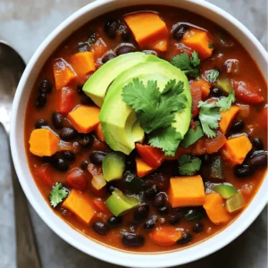 - 2 medium sweet potatoes, peeled and diced into 1-inch cubes - 1 can (15 oz) black beans, drained and thoroughly rinsed - 1 can (14 oz) diced tomatoes, with juice - 1 cup vegetable broth or stock - 1 medium onion, diced - 2 cloves garlic, minced - 1 bell pepper (red or green), diced - 1 tablespoon chili powder - 1 teaspoon ground cumin - 1/2 teaspoon smoked paprika - Salt and freshly ground black pepper to taste - 2 tablespoons extra virgin olive oil - Fresh cilantro leaves, chopped, for garnish - Avocado slices, for topping (optional) This chili combines sweet potatoes, black beans, and tomatoes for a hearty dish. Sweet potatoes add natural sweetness, while black beans provide protein and texture. Diced tomatoes bring acidity and moisture. The vegetable broth gives depth to the flavor. You can add onion, garlic, and bell pepper for a flavor boost. The seasoning mix of chili powder, cumin, and smoked paprika creates a warm, inviting taste. For a fresh touch, use chopped cilantro and creamy avocado as toppings. These optional garnishes add color and flavor. Serve this chili hot for a comforting meal. Check out the Full Recipe for all the details! 1. Start by heating the olive oil in a large pot over medium heat. 2. Once the oil is hot, add the diced onion and bell pepper. 3. Sauté the veggies for about 5 minutes. Stir often until the onion looks clear and soft. 4. Next, add the minced garlic, chili powder, ground cumin, and smoked paprika to the pot. 5. Cook for one more minute while stirring to let the spices mix well and smell great. 1. Now, it’s time to add the diced sweet potatoes. Stir them in and cook for another 5 minutes. 2. Pour in the diced tomatoes with their juice, along with the vegetable broth. 3. Mix everything together well, making sure the sweet potatoes are coated in the liquid. 1. Raise the heat to bring the chili to a gentle boil. 2. Once boiling, lower the heat and cover the pot. Let it simmer for about 20 minutes. 3. Check if the sweet potatoes are soft enough to pierce with a fork. 4. After 20 minutes, stir in the rinsed black beans. 5. Simmer for an additional 5 minutes to make sure everything is heated through. 6. Finally, taste the chili and add salt and black pepper as needed for extra flavor. For the full recipe, check out the complete instructions. To get the best texture from sweet potatoes, cut them into even 1-inch cubes. This helps them cook evenly. Boiling them until fork-tender can make them mushy, so keep an eye on the pot. For spice lovers, you can adjust the heat by adding more chili powder or fresh jalapeños. Start small and taste as you go. You can always add more! Chili pairs well with many sides. Cornbread is a classic choice. You can also serve it with tortilla chips for crunch. When it comes to bowls, use colorful ones to make the dish pop. Top your chili with fresh cilantro and avocado slices. A wedge of lime adds a nice zing. This makes your dish look and taste great! Sweet potatoes are rich in vitamins A and C. They also have fiber that aids digestion. Black beans are packed with protein, making this chili filling and nutritious. Using fresh ingredients boosts flavor and health. Fresh veggies have more nutrients than canned ones. This chili is not just tasty; it’s good for you too! For the full recipe, check out the Full Recipe section. {{image_4}} You can swap out the black beans for other beans like kidney or pinto beans. You can also use chickpeas for a different taste. If you want extra veggies, try adding corn or zucchini. For meat lovers, you can add ground turkey or beef. Brown the meat before adding the veggies. This gives a hearty twist to the sweet potato black bean chili. To take your chili to the next level, try adding different spices. Consider using smoked chili powder or even a pinch of cinnamon for warmth. If you like heat, add chopped jalapeños or a splash of hot sauce. This adds a nice kick and balances the sweetness of the sweet potatoes. Chili is so versatile! Serve it over rice or quinoa for a filling meal. This adds texture and helps soak up the sauce. Another fun idea is to make chili-stuffed bell peppers. Just hollow out some peppers, fill them with the chili, and bake until the peppers are tender. This makes for a great presentation and a tasty twist on the classic dish. To keep your Sweet Potato Black Bean Chili fresh, use airtight containers. Glass or plastic containers with tight lids work best. You can also use resealable bags if you squeeze out the air first. Your chili will stay good in the fridge for about 4 to 5 days. Just make sure it cools down before you store it. Freezing chili is a great way to save it for later. To freeze, let the chili cool completely. Then, pour it into freezer-safe containers or bags. Leave some space at the top since the chili will expand when it freezes. It will last about 3 months in the freezer. When you’re ready to eat, take the chili out and thaw it in the fridge overnight. If you're in a hurry, you can also use the microwave. Just make sure to stir it while reheating to warm it evenly. Enjoy your meal as if it was just made! For the complete recipe, check out the Full Recipe. To make this chili, follow these steps: 1. Sauté Vegetables: Heat olive oil in a large pot. Add diced onion and bell pepper. Cook for about 5 minutes until soft. 2. Add Spices: Mix in minced garlic, chili powder, cumin, and smoked paprika. Cook for 1 more minute. 3. Incorporate Sweet Potatoes: Add diced sweet potatoes. Stir and cook for 5 minutes. 4. Combine Tomatoes and Broth: Pour in diced tomatoes and vegetable broth. Mix well. 5. Simmer: Bring to a boil, then lower the heat and cover. Let it simmer for 20 minutes. 6. Add Black Beans: Stir in rinsed black beans and cook for another 5 minutes. 7. Season: Taste and add salt and pepper as needed. 8. Serve: Garnish with cilantro and avocado slices if you like. You can find the Full Recipe [here](#). Yes, you can use fresh black beans. - Preparation: You must soak the beans overnight. This helps them cook evenly. - Cooking Time: Fresh beans take longer to cook. Boil them for about 1-1.5 hours before adding to the chili. Using fresh beans gives a great texture and taste, but it requires more time. To add spice, try these methods: - Chili Powder: Increase the amount of chili powder. - Jalapeños: Add diced jalapeños when you sauté the vegetables. - Hot Sauce: Drizzle hot sauce on top before serving. Feel free to adjust the spice level to fit your taste! This chili is packed with nutrients: - Sweet Potatoes: High in vitamins A and C. Great for your immune system. - Black Beans: A good source of protein and fiber. They help keep you full. - Vegetables: Onions and peppers add vitamins and minerals without many calories. Enjoying this chili means you get a tasty meal that’s also good for you. Yes, you can make this chili ahead of time. - Meal Prep: Cook the chili and let it cool. Store in a container. - Best Practices: Refrigerate for up to 3 days. For longer storage, freeze it in portions. Reheat in the microwave or on the stove before serving. Making it in advance saves time and enhances flavors! This blog post covered everything you need for Sweet Potato Black Bean Chili. We explored the main and optional ingredients, provided step-by-step instructions, and shared useful tips. Remember, using fresh ingredients boosts flavor and health benefits. Feel free to adjust spices or try different variations to make it your own. Enjoy this comforting dish, whether you serve it plain or dressed with toppings! Happy cooking!
