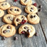 - 1 cup all-purpose flour - 1/2 teaspoon baking soda - 1/4 teaspoon salt - 1/2 cup unsalted butter, softened - 1/4 cup granulated sugar - 1/4 cup packed brown sugar - 1 teaspoon vanilla extract - 1 large egg yolk - 1/2 cup dark chocolate chips - 1/2 cup dried cherries, roughly chopped - 1/4 cup optional chopped walnuts For these Cherry Chocolate Chip Cookie Bites, I always choose high-quality ingredients. The all-purpose flour gives a nice structure. Baking soda helps the cookies rise just right. A little salt balances the sweetness of the sugars. I love using unsalted butter. It makes it easy to control the salt in the recipe. Both granulated and brown sugars add depth of flavor. The brown sugar keeps the cookies chewy. Vanilla extract lifts the flavors. The egg yolk also adds richness and moisture. Dark chocolate chips are my favorite because they give a nice, rich taste. Dried cherries bring a sweet and tart contrast, while walnuts add a crunchy texture. For a twist, you can swap in different nuts or fruits. This recipe is flexible, so feel free to make it your own. Check out the Full Recipe for all the details on how to prepare these tasty bites. Preparation of Ingredients 1. First, preheat your oven to 350°F (175°C). This step is key to getting the right texture for your cookie bites. 2. Next, prepare your baking sheet. Line it with parchment paper. This helps the cookie bites not stick. Mixing the Dough 1. In a medium bowl, mix the dry ingredients. Combine 1 cup of all-purpose flour, 1/2 teaspoon of baking soda, and 1/4 teaspoon of salt. Whisk until it’s smooth, then set it aside. 2. In a large bowl, cream together 1/2 cup of softened butter, 1/4 cup of granulated sugar, and 1/4 cup of brown sugar. Use an electric mixer or a spatula. Beat for about 2-3 minutes until it’s fluffy and smooth. Forming and Baking Cookie Bites 1. Add 1 teaspoon of vanilla extract and 1 large egg yolk to the creamy mixture. Mix well until everything is combined. 2. Gradually add the dry mixture to the wet mixture. Stir gently until just mixed. Don’t overmix; you want a nice dough. 3. Fold in 1/2 cup of dark chocolate chips and 1/2 cup of chopped dried cherries. If you like, add 1/4 cup of walnuts. Make sure they spread evenly in the dough. 4. Use a teaspoon to scoop out small bits of dough. Roll them into bite-sized balls. Place them on the baking sheet, leaving about 2 inches between each ball. 5. Bake in the preheated oven for 8-10 minutes. Look for lightly golden edges, but keep the centers soft. This gives them a chewy texture. 6. After baking, let the cookie bites cool on the sheet for about 5 minutes. Then, move them to a wire rack to cool completely. For a detailed list of all steps, check the Full Recipe. To get the best texture, bake your cookie bites for 8-10 minutes. Look for soft centers and lightly golden edges. Underbaking is key for chewy cookies. When you take them out, they will continue to cook on the sheet. This creates a tender bite that melts in your mouth. You can boost flavor by adding extracts, like almond or orange. These add a unique twist to your cookie bites. If you need substitutions, replace butter with a dairy-free option. You can also swap out the egg yolk with applesauce for a vegan treat. This keeps the cookie moist and tasty. Serve your cookie bites on a pretty plate for a special touch. Dust them with powdered sugar for a fancy look. Pair these cookies with a glass of cold milk or hot coffee. This combination makes the flavors pop and adds to the fun of eating them. For the full recipe, check out the details above! {{image_4}} You can change the dried cherries for other dried fruits. Try dried apricots or cranberries. Both bring a new taste to your cookie bites. You can also use different types of chocolate. White chocolate chips can add a sweet touch. Milk chocolate gives a creamier taste. Mix and match to find your favorite! If you want to make these gluten-free, you have some good choices. Almond flour works well as a substitute. It gives a nice nutty flavor. You can also use coconut flour, but use less of it. This flour absorbs more moisture. Use only about a quarter of the amount. For a vegan version, replace the egg yolk. You can use a flaxseed egg. Mix one tablespoon of ground flaxseed with three tablespoons of water. Let it sit for a few minutes to thicken. Use a dairy-free butter like coconut oil or vegan margarine. This keeps the cookie bites soft and tasty. For the full recipe, check out the link provided. To keep your cherry chocolate chip cookie bites fresh, let them cool completely before you store them. If you store warm cookies, they become soggy and lose their nice texture. Use airtight containers to keep them fresh. A glass jar or plastic container works well. Line the bottom with parchment paper. This helps absorb any extra moisture. You can freeze both unbaked and baked cookie bites. For unbaked bites, scoop the dough onto a baking sheet lined with parchment paper. Freeze them for about an hour. Then, transfer the frozen balls into a freezer bag. This keeps them from sticking together. If you have baked cookie bites, let them cool first. Then, place them in a freezer bag or airtight container. To thaw, take out what you need and leave them at room temperature for about 30 minutes. They will taste almost as good as fresh! If you want a warm cookie bite, pop it in the microwave for a few seconds. Enjoy your delightful treat with ease! Look for a few key signs to know when your cookie bites are done baking. The edges should turn a light golden brown. The centers must appear soft and slightly underbaked. This gives you a chewy texture that everyone loves. Bake them for about 8 to 10 minutes. Keep an eye on them, as ovens can vary. If you see these signs, your cookie bites are ready! Yes, you can make the dough ahead of time! After mixing the dough, cover it tightly with plastic wrap. You can store it in the fridge for up to two days. This way, you can bake fresh cookie bites whenever you want. If you want to keep it longer, freeze the dough. Just scoop the dough into balls and freeze them on a baking sheet. Once frozen, transfer them to a container. They can last up to three months in the freezer. If you don't have dried cherries, don't worry! You can use other dried fruits. Dried cranberries or raisins work great as substitutes. You can also try chopped dried apricots for a different taste. Each fruit adds its own flavor, making your cookie bites unique. You can mix and match to find your favorite combination! You’ve learned how to make tasty cherry chocolate chip cookie bites. We covered the ingredients, step-by-step instructions, tips for the best texture, and variations to try. Now, you can create your own fun cookie treats. Remember to store them properly or freeze some for later. This delightful recipe is simple and allows for many tweaks. Enjoy baking and sharing these treats with friends and family! Now, grab your ingredients and start creating something delicious!
