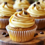 To make Pumpkin Spice Latte Cupcakes, gather these simple ingredients: - 1 ½ cups all-purpose flour - 1 teaspoon baking powder - ½ teaspoon baking soda - ½ teaspoon salt - 1 teaspoon ground cinnamon - ½ teaspoon ground nutmeg - ¼ teaspoon ground ginger - ½ cup unsalted butter, softened at room temperature - 1 cup granulated sugar - 2 large eggs, at room temperature - 1 cup canned pumpkin puree - ½ cup brewed coffee, cooled to room temperature - 1 teaspoon vanilla extract For the frosting, use: - 1 cup unsalted butter, softened at room temperature - 4 cups powdered sugar, sifted for smoothness - 2 tablespoons brewed coffee, cooled - 1 teaspoon vanilla extract - ½ teaspoon ground cinnamon These ingredients create a warm and cozy flavor in every bite. The spices bring a hint of autumn while the coffee adds a rich depth. When you mix these together, you'll have a delightful treat perfect for fall. For the full recipe, check out the complete instructions that guide you through each step. - Set oven temperature to 350°F (175°C) - Line muffin pan with cupcake liners Start by preheating your oven to 350°F (175°C). This is key for even baking. While the oven warms up, take a 12-cup muffin pan and line it with festive cupcake liners. The liners not only make cleanup easier, but they also add a fun touch to your cupcakes. - Mix flour, baking powder, baking soda, salt, and spices In a medium bowl, mix together the dry ingredients. Combine 1 ½ cups all-purpose flour, 1 teaspoon baking powder, ½ teaspoon baking soda, and ½ teaspoon salt. Then, add the spices: 1 teaspoon ground cinnamon, ½ teaspoon ground nutmeg, and ¼ teaspoon ground ginger. Whisk these together thoroughly. This step helps distribute the leavening agents and spices evenly. - Instructions for mixing butter and sugar until fluffy In a large bowl, use an electric mixer to beat ½ cup softened butter and 1 cup granulated sugar together. Mix on medium speed for about 3-4 minutes, or until the mixture is light and fluffy. This step is crucial because it adds air to the batter, giving your cupcakes a nice rise. - Mixing eggs, pumpkin, coffee, and vanilla Next, add 2 large eggs, one at a time, mixing well after each addition. After that, stir in 1 cup canned pumpkin puree, ½ cup cooled brewed coffee, and 1 teaspoon vanilla extract. Mix gently until everything is smooth and well combined. This mixture brings flavor and moisture to your cupcakes. - Tips for combining mixtures without overmixing Now, it’s time to combine the wet and dry ingredients. Gradually add the dry mixture to the wet mixture. Stir gently with a spatula or wooden spoon until the flour disappears. Be careful not to overmix; it’s okay to leave a few small lumps. This helps keep your cupcakes light and fluffy. - Fill muffin pan and baking time instructions Evenly distribute the batter into the cupcake liners, filling each about two-thirds full. This allows room for rising. Place the muffin pan in the preheated oven and bake for 18-20 minutes. Check for doneness by inserting a toothpick into the center of a cupcake. If it comes out clean, your cupcakes are ready. Let them cool in the pan for about 5 minutes before transferring them to a wire rack to cool completely. - Steps for making the frosting while cupcakes cool While your cupcakes cool, prepare the frosting. In a large bowl, beat 1 cup softened butter with an electric mixer until smooth and creamy. This base is important for a fluffy frosting. - Instructions for applying frosting creatively Gradually add 4 cups sifted powdered sugar to the butter mixture. Start mixing on low speed to avoid a sugar cloud, then increase to medium speed. Add 2 tablespoons cooled brewed coffee, 1 teaspoon vanilla extract, and ½ teaspoon ground cinnamon. Mix until it’s light and fluffy. Once the cupcakes are cool, frost each cupcake generously with the coffee-flavored frosting. Create fun swirls or peaks as you like. For more details, check out the full recipe. To ensure your cupcakes rise well, use fresh baking powder and baking soda. This will give your cupcakes a nice lift. Also, fill each liner about two-thirds full. This allows room for the cupcakes to rise without overflowing. Room temperature ingredients are key. Take your butter, eggs, and coffee out ahead of time. Soft butter mixes better with sugar, creating a fluffy batter. Room temperature eggs also blend well, adding moisture to your cupcakes. For a pleasing presentation, use a piping bag to frost your cupcakes. This method lets you create lovely swirls or peaks. You can also use a spatula for a more rustic look. Just spread the frosting thickly on top for a cozy vibe. Consider adding different styles to your frosting. Try creating a tall peak for fun. You can also make a smooth finish for a classy look. Each style adds its own charm. To take your cupcakes to the next level, add extra spices. A pinch of allspice brings warmth, while a dash of cloves adds depth. You can also try adding a splash of vanilla extract for a richer flavor. For a fun twist, mix in some chocolate chips or nuts. This adds texture and flavor to every bite. With these enhancements, your pumpkin spice latte cupcakes will stand out even more. For the full recipe, you can refer back to the earlier sections. {{image_4}} You can make your Pumpkin Spice Latte Cupcakes even better with fun add-ins. Try adding chocolate chips for a sweet twist. Dark chocolate pairs nicely with pumpkin flavors. You can also use chopped nuts, like walnuts or pecans, for some crunch. Just fold them in gently at the end. If you want to spice things up, why not add a dash of allspice or cloves? These spices can enhance the warm flavor profile. A pinch of cardamom could also give a unique twist. Experiment with different combinations to find your favorite mix! While the coffee buttercream is delightful, you can switch it up. Cream cheese frosting adds a tangy flavor that works well with pumpkin. To make it, just mix cream cheese, butter, powdered sugar, and vanilla. If you prefer something richer, try a chocolate ganache. Just melt chocolate with heavy cream and let it cool. It becomes thick and glossy, perfect for drizzling over your cupcakes. For those who need gluten-free options, use almond flour or a gluten-free flour blend. Make sure the flour blend has a binding agent, like xanthan gum. For dairy-free diets, swap butter for coconut oil or dairy-free margarine. Use a dairy-free milk in the cupcake batter. These simple swaps keep the flavor and texture while meeting dietary needs. You can enjoy these cupcakes no matter your diet! For the full recipe, check the main section above. To keep your pumpkin spice latte cupcakes fresh for a few days, follow these tips: - Place cupcakes in an airtight container. - Store them at room temperature for up to three days. - If you prefer, refrigerate them to last up to a week. - Always frost them just before serving for best taste. For long-term storage, you can freeze your cupcakes and frosting: - Allow the cupcakes to cool completely before freezing. - Wrap each cupcake tightly in plastic wrap. - Place them in a freezer-safe bag or container. - For frosting, store it in a separate airtight container. - Cupcakes can last up to three months in the freezer. To defrost your cupcakes without losing texture: - Take them out of the freezer and remove the wrap. - Let them sit at room temperature for about 1-2 hours. - For the frosting, let it sit out for about 30 minutes. - Once defrosted, frost the cupcakes and enjoy! These simple storage methods help keep your pumpkin spice latte cupcakes tasting fresh and delicious. For more detailed baking instructions, check the full recipe! Yes, you can make these cupcakes ahead of time. To do this, bake the cupcakes and let them cool completely. Then, store them in an airtight container at room temperature. This keeps them fresh for up to three days. If you want to frost them later, wait until you are ready to serve. Frosting can be made a day in advance and stored in the fridge. Just let it sit at room temperature for a bit before using. If you cannot find pumpkin puree, you have options. You can use sweet potato puree as a great substitute. Mashed bananas can work too, but they will change the flavor. Applesauce is another choice, giving a different sweetness. If you prefer a different taste, try using butternut squash puree. Each option gives a unique twist while keeping the moist texture. Cupcakes can sink for several reasons. Overmixing the batter can cause this issue. Mix just until the flour disappears to avoid this. Another cause is too much leavening agent. Make sure to measure baking powder and baking soda correctly. Lastly, check your oven temperature. An oven that is too hot can lead to cupcakes rising too quickly and then sinking. Yes, you can use instant coffee as a substitute. Just mix one tablespoon of instant coffee with one tablespoon of hot water. This will mimic brewed coffee in your cupcakes. However, brewed coffee gives a richer flavor. If you want a stronger coffee taste, use less water when mixing your instant coffee. This way, you can keep the flavor strong and yummy. You now have all the tools to make delicious pumpkin cupcakes. We covered the ingredients, step-by-step instructions, and cooking tips. I shared ideas for fun variations and how to store your treats. Remember to have fun and be creative with your baking. Whether it’s for a special occasion or just a treat for yourself, these cupcakes are sure to please. Enjoy baking these tasty pastries and share them with others!