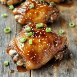To make this dish, gather these items: - 4 bone-in, skin-on chicken thighs - 1/4 cup honey - 1/4 cup low-sodium soy sauce - 4 cloves garlic, finely minced - 1 tablespoon fresh ginger, finely grated - 1 tablespoon rice vinegar - 1 teaspoon sesame oil - 1/2 teaspoon freshly ground black pepper - 1/2 teaspoon red pepper flakes (optional) - 2 green onions, finely sliced (for garnish) - A sprinkle of sesame seeds (for garnish) These ingredients bring a sweet and savory flavor to the chicken. The honey adds a nice touch of sweetness. The soy sauce gives depth and umami. Garlic and ginger create a fragrant aroma that makes your kitchen smell amazing. You can add a few extras to enhance your dish: - Sliced red chili for a spicy kick - Fresh cilantro for a burst of freshness - Lime wedges for a zesty touch These garnishes are not mandatory but can make your meal pop with color and taste. They also provide different flavors that can complement the chicken. When selecting your ingredients, consider these tips: - Chicken Thighs: Look for thighs with good fat content. This helps keep the meat juicy. - Honey: Choose pure honey for the best flavor. Avoid blends with added sugars. - Soy Sauce: Low-sodium soy sauce is great for a balanced taste. - Freshness: Always pick fresh garlic and ginger. They elevate your dish with rich flavors. High-quality ingredients will always make your dish better. Take your time to choose the best ones. To start, gather your ingredients for the marinade. You need: - 1/4 cup honey - 1/4 cup low-sodium soy sauce - 4 cloves garlic, finely minced - 1 tablespoon fresh ginger, finely grated - 1 tablespoon rice vinegar - 1 teaspoon sesame oil - 1/2 teaspoon freshly ground black pepper - 1/2 teaspoon red pepper flakes (optional) In a medium mixing bowl, combine all these ingredients. Whisk them well until they blend together. This mix will be sweet and savory, making your chicken taste amazing. Next, take your chicken thighs. You will use 4 bone-in, skin-on thighs for the best flavor. Place them in a large resealable plastic bag or a shallow dish. Pour the marinade over the chicken. Make sure every piece is coated well. Seal the bag or cover the dish tightly. Refrigerate the chicken for at least 1 hour. If you want a stronger flavor, marinate overnight. This allows the chicken to soak up all those delicious flavors. When you’re ready to cook, preheat your oven to 400°F (200°C). Take the chicken out of the marinade, but keep the marinade for later. In a large oven-proof skillet, heat a tablespoon of oil over medium-high heat. Once the oil is hot, add the chicken thighs skin side down. Sear them for 4-5 minutes. You want the skin to turn golden and crispy. After that, flip the thighs so they are skin side up. Pour the reserved marinade over them. Allow it to simmer gently. Then, move the skillet into the preheated oven. Roast for 25-30 minutes. The chicken is ready when it reaches an internal temperature of 165°F (75°C). Once done, take the skillet out and let the chicken rest for 5 minutes. This helps keep the chicken juicy. As it rests, the sauce will thicken slightly. Now you are ready to serve your honey soy garlic chicken thighs! To get that crispy skin, start with bone-in, skin-on chicken thighs. The skin keeps the meat juicy while adding flavor. Here’s how to do it: - Sear the chicken: Use a hot skillet with oil. Place the thighs skin-side down. Sear for 4-5 minutes until golden. This step is key to crispy skin. - Don’t overcrowd the pan: Make sure there’s space around each thigh. This helps them cook evenly and crisps the skin. Balancing sweet and savory is essential for this dish. Here’s what I recommend: - Use low-sodium soy sauce: This keeps the dish from being too salty. You can adjust the flavor with honey and garlic. - Fresh ingredients: Always use fresh garlic and ginger. They add depth and brightness to the dish. - Taste the marinade: Before adding the chicken, taste it. Adjust with more honey for sweetness or soy for saltiness. Having the right tools makes cooking easier and more fun. Here are my top picks: - Large oven-proof skillet: This lets you sear and roast in one pan. - Meat thermometer: Checking the internal temperature ensures the chicken is safe to eat. Aim for 165°F (75°C). - Whisk: Use a whisk to mix the marinade well. It helps combine all the flavors evenly. With these tips, you can master Honey Soy Garlic Chicken Thighs and impress everyone at the dinner table. Happy cooking! {{image_4}} You can give this dish a kick by adding heat. Use red pepper flakes in the marinade. Add one teaspoon for mild heat or two teaspoons for a hotter flavor. You can also use fresh chopped chili peppers. This will spice up the sweet and savory mix. Chicken thighs are great, but you can switch it up. Try using chicken breasts for a leaner option. If you're feeling adventurous, use tofu or tempeh. Marinate them just like the chicken. They absorb the flavors well and make a tasty dish for everyone. You can cook this dish in two main ways: grilling or baking. Grilling gives the chicken a smoky flavor. Preheat your grill and cook the thighs for about 6-8 minutes per side. Baking is simple and hands-off. Just follow the steps in the recipe for perfect results. Both methods will yield delicious Honey Soy Garlic Chicken Thighs. Choose what fits your mood! To keep your Honey Soy Garlic Chicken Thighs fresh, let them cool. Place the chicken in an airtight container. Store it in the fridge for up to three days. Make sure to keep any extra sauce in a separate container. This helps to maintain the taste and texture. If you want to store the chicken for longer, freezing is a great option. Wrap each chicken thigh tightly in plastic wrap. Then, place them in a freezer-safe bag or container. Label the bag with the date. You can freeze the chicken for up to three months. When ready to enjoy, thaw it in the fridge overnight. Reheating chicken can be tricky. To keep it juicy, preheat your oven to 350°F (175°C). Place the chicken in a baking dish and cover it with foil. Heat for about 15-20 minutes. If you have extra sauce, pour it over before reheating. This keeps the chicken moist and flavorful. You can also use a microwave, but the oven gives better results. You should marinate the chicken for at least 1 hour. For the best taste, let it sit overnight. The longer you marinate, the more flavor the chicken absorbs. This helps the honey, soy sauce, and garlic mix into the meat, making it juicy and delicious. Yes, you can use boneless chicken thighs. They cook faster and are easier to eat. Just be mindful of the cooking time. Boneless thighs may need 20 to 25 minutes in the oven. Always check that the inside reaches 165°F (75°C) for safety. Many sides go well with this dish. Here are a few ideas: - Steamed rice: It absorbs the sauce well. - Roasted vegetables: They add color and nutrients. - Simple salad: Fresh greens balance the savory chicken. - Stir-fried noodles: They provide a fun twist. - Mashed potatoes: Creamy potatoes pair nicely with the sauce. These sides will complement the sweet and savory flavors of the chicken. This blog post detailed how to make Honey Soy Garlic Chicken Thighs. We explored the key ingredients and steps for marinating and cooking. We also shared tips for the best flavors and textures. You learned about variations and how to store leftovers. Mastering this dish brings joy to your kitchen. With practice, you'll impress your family and friends. Enjoy experimenting with flavors and techniques. Happy cooking!