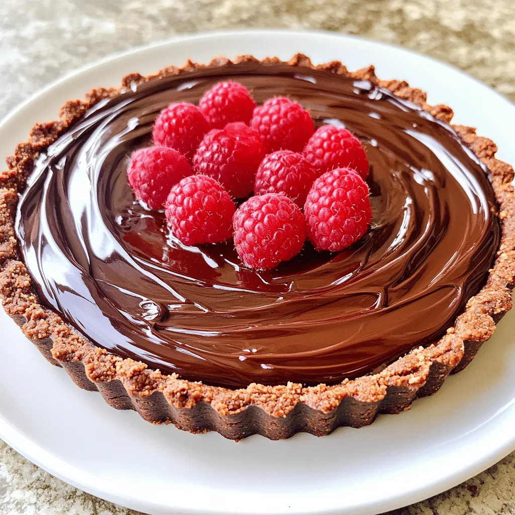 - 1 ½ cups chocolate cookie crumbs - ½ cup unsalted butter, melted - 1 cup dark chocolate chips (preferably 60% cocoa) - 1 cup heavy cream - 1 teaspoon vanilla extract - Pinch of sea salt - 1 cup fresh raspberries (plus extra for garnish) - 2 tablespoons powdered sugar The ingredients for this No Bake Raspberry Chocolate Tart are simple yet rich. The chocolate crust forms a great base. You can use chocolate cookie crumbs, like Oreos or digestive biscuits. Melted unsalted butter helps bind it together. The chocolate filling is where the magic happens. Dark chocolate chips give depth to the flavor. I prefer 60% cocoa for a nice balance. Heavy cream makes it smooth and creamy, while vanilla extract adds warmth. Just a pinch of sea salt brings out the chocolate taste. The raspberry puree adds a fresh twist. You need fresh raspberries for this. They offer a bright and tangy flavor. Mixing them with powdered sugar creates a delightful puree. The sweetness of the sugar balances the tartness of the berries perfectly. These ingredients work together to create layers of flavor. You’ll have a rich chocolate filling combined with a fruity raspberry twist. Each bite is a burst of delight! First, grab a medium bowl. Combine 1 ½ cups of chocolate cookie crumbs with ½ cup of melted butter. Use a fork or a spatula to mix until every crumb is coated. This step is key for a tasty crust. Next, take a 9-inch tart pan and pour the crumb mixture inside. Press it firmly into the bottom and up the sides. Make sure it forms an even layer with no gaps. Now, chill the crust in the fridge for 10-15 minutes. This helps it set properly. While the crust chills, let’s make the filling. In a small saucepan, heat 1 cup of heavy cream over medium heat. Watch closely as it simmers. Once it bubbles, take it off the heat. Add 1 cup of dark chocolate chips to the hot cream. Let them sit for 2-3 minutes. This softens the chocolate. Then, stir gently until the mix is smooth and shiny. Add 1 teaspoon of vanilla extract and a pinch of sea salt. Mix well to combine all the flavors. Now, let’s make the raspberry puree. Take 1 cup of fresh raspberries and put them in a bowl. Add 2 tablespoons of powdered sugar. Use a fork to mash the raspberries gently. You want a chunky puree, so don’t overdo it. Some pieces should stay intact for texture. It’s time to put it all together! Carefully fold the raspberry puree into the chocolate filling. Be gentle to keep some raspberry chunks. Then, pour this mixture into the chilled crust. Use a spatula to smooth the top. This gives it a nice finish. Place the tart in the refrigerator for at least 4 hours. This helps it firm up and set completely. The wait is worth it for the perfect no-bake dessert! To make the crust just right, you need to coat the crumbs well. Mix the chocolate cookie crumbs and melted butter until they feel moist. This keeps your crust from falling apart. When you press the mixture into the tart pan, do it firmly. Make sure it is even and packed tight. If it’s loose, the tart will crumble when you slice it. When you heat the heavy cream, watch it closely. You want it to simmer but not boil. After removing it from heat, add the dark chocolate chips. Let them sit for 2-3 minutes. This helps them melt without burning. Stir gently until the mix is smooth and glossy. It should look shiny and rich. Add the vanilla extract and a pinch of sea salt to enhance the flavor. To make your tart look stunning, add fresh raspberries on top. You can also add a dollop of whipped cream. This adds a nice touch and makes the tart look fancy. A light drizzle of chocolate sauce can also elevate your dish. Enjoy the beautiful mix of red and dark brown. It makes for a delightful dessert! {{image_4}} You can change the flavor of your No Bake Raspberry Chocolate Tart easily. Try using graham cracker crumbs instead of chocolate cookie crumbs. This swap gives a nice, sweet crunch. If you want a fun twist, add almond or mint extract to the chocolate filling. Just a few drops can brighten the taste and add charm. Want to mix it up? Incorporate nuts like chopped hazelnuts or almonds into the filling for a bit of crunch. You can also add different berries, such as strawberries or blueberries. These options give you a new taste, while keeping the tart fresh and exciting. You can make mini tarts or bite-sized pieces for a fun presentation. Use small tart pans or muffin tins to shape them. These smaller portions are great for parties or gatherings. You can also serve them on a big platter, making it easy for guests to grab one. Enjoy the fun of personalizing this delightful dessert! You can store your no-bake raspberry chocolate tart in the fridge. Use an airtight container to keep it fresh. If you want to freeze it, wrap the tart tightly in plastic wrap. Then, place it in a freezer bag. This will help prevent freezer burn. The tart lasts for about 5 days in the fridge. Make sure to keep it covered. If frozen, it can last up to 2 months. Just remember to thaw it overnight in the fridge before serving. Reheating is not usually needed for this tart. It tastes best when chilled. If you want to serve it warm, let it sit at room temperature for about 10 minutes. This will soften the chocolate slightly without losing its texture. Yes, you can use frozen raspberries. They work, but fresh raspberries taste better. Frozen berries may be softer after thawing. They can also add extra moisture to your tart. If you choose frozen, drain any excess water. This helps keep the tart from becoming soggy. Absolutely! You can make this tart dairy-free. Swap the heavy cream for coconut cream. Use dairy-free chocolate chips instead of dark chocolate chips. These changes keep the taste rich and delicious. Look for brands that have no dairy. This way, you can enjoy the tart without dairy. To make this tart gluten-free, choose gluten-free cookies for the crust. Look for brands that offer gluten-free chocolate cookies. You can also use crushed gluten-free graham crackers. Ensure all your ingredients are labeled gluten-free. This way, everyone can enjoy your tart without worry. Yes, you can prepare the tart ahead of time. Make it a day before serving for the best taste. Keep it in the fridge to let it set. This helps the flavors blend well. When ready to serve, garnish it with fresh raspberries. It will look beautiful and taste fresh! This blog post covered how to make a delicious chocolate raspberry tart. You learned about the key ingredients, from the chocolate crust to the raspberry puree. I shared step-by-step instructions to guide you through each part. With tips on perfecting your tart and fun variations, you can get creative and make it your own. Remember, this tart is tasty and easy to customize. Enjoying it with friends or family will make it even better. Happy baking!