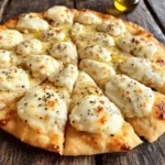 - 1 cup low-fat cottage cheese - 1 large egg - 1 cup oat flour (or substitute with almond flour if preferred) - 1/2 cup shredded mozzarella cheese - 1 teaspoon baking powder - 1 teaspoon Italian seasoning - 1/2 teaspoon garlic powder - 1/4 teaspoon salt - Olive oil (for greasing) Using these ingredients makes a tasty crust. Low-fat cottage cheese gives protein and creaminess. The egg helps bind the crust, making it firm. Oat flour or almond flour creates a gluten-free base. Mozzarella cheese melts beautifully, enhancing flavor. Baking powder gives it a nice rise. Italian seasoning and garlic powder add a delicious taste. You can adjust the spices to fit your palate. Seasoning makes a big difference in flavor. Olive oil helps prevent sticking and adds richness. Each ingredient plays a key role in making this crust tasty and healthy. 1. Preheat the oven and prep the baking sheet: First, set your oven to 400°F (200°C). This helps the crust bake evenly. Prepare your baking sheet by lining it with parchment paper or lightly greasing it with olive oil. This will make sure the crust does not stick. 2. Mix cottage cheese and egg until smooth: In a medium bowl, add 1 cup of low-fat cottage cheese and 1 large egg. Use a whisk to mix these until they are smooth and creamy. This step is key for a tasty crust. 3. Incorporate dry ingredients into the mixture: Gradually stir in 1 cup of oat flour, 1 teaspoon of baking powder, 1 teaspoon of Italian seasoning, 1/2 teaspoon of garlic powder, and 1/4 teaspoon of salt. Mix well until you form a soft dough. Finally, fold in 1/2 cup of shredded mozzarella cheese for a cheesy flavor. 1. Form the pizza crust: Carefully transfer the dough onto your prepared baking sheet. Use your hands or a spatula to shape the dough into a round pizza crust. Aim for a thickness of about 1/2 inch. 2. Bake the crust until golden brown: Place the baking sheet in your preheated oven. Let it bake for 15-20 minutes. You want a golden-brown crust that feels firm when touched. 3. Add toppings and finish baking: After baking, take the crust out of the oven. Now it's time to add your favorite pizza sauce and toppings. Return the pizza to the oven for another 10-15 minutes. This will melt the cheese and make it bubbly. Enjoy your protein-packed pizza! To get a crispy crust, focus on your baking method. Start by preheating your oven to 400°F (200°C). Use a baking sheet lined with parchment paper for easy cleanup. If you want extra crunch, consider using a pizza stone. A stone holds heat well, giving your crust a nice crisp. For thickness, aim for about 1/2 inch. If it’s too thick, the center may stay soft. A thinner crust will bake faster and get crispier. You can also bake it a bit longer. Just watch it so it doesn't burn. To elevate the taste of your crust, mix in herbs and spices. Try adding dried oregano or basil for an Italian touch. A pinch of red pepper flakes adds a nice kick. Garlic powder is another great addition; it gives rich flavor without being overpowering. For cheese, use shredded mozzarella for creamy texture. You can also mix in some Parmesan for a savory twist. If you want a sharp flavor, consider adding cheddar cheese. A blend of cheeses works well, too. Experiment to find your favorite combo! {{image_4}} If you need a gluten-free crust, you can use a simple swap. Replace oat flour with almond flour. Almond flour makes the crust light and nutty. You can also use other gluten-free flours like coconut flour or rice flour. Just remember, each flour has a different texture. You may need to adjust other wet ingredients. Try adding a bit more cottage cheese or egg if the dough seems too dry. You can change up the taste of your crust easily. Try different cheeses for unique flavors. Parmesan or cheddar adds a rich taste. Mixing cheeses can make things extra fun. You can also fold in fresh herbs like basil or oregano for a fresh twist. Adding vegetables directly into the crust is another great option. Finely chopped spinach, bell peppers, or zucchini can boost flavor and nutrients. Just make sure to drain excess moisture from the veggies. This keeps your crust from getting soggy. You can mix and match flavors to create your perfect pizza base. To keep your high-protein cottage cheese pizza crust fresh, store it in the fridge. First, let the crust cool completely. Then, wrap it tightly in plastic wrap or place it in an airtight container. This helps to avoid moisture loss and keeps the crust tasty. When you are ready to eat leftover pizza, reheat it in the oven. Preheat your oven to 350°F (175°C). Place the pizza on a baking sheet and heat for about 10-15 minutes. This warms it up and keeps the crust crispy. You can also use a microwave, but it may make the crust softer. You can freeze both uncooked and cooked pizza crust. For uncooked crust, shape it on a baking sheet. Then, place the baking sheet in the freezer. Once the crust is firm, wrap it tightly in plastic wrap and store it in a freezer bag. This way, it will last for up to three months. To freeze cooked pizza, let it cool completely. Then, slice it into pieces. Wrap each slice in plastic wrap and store in a freezer bag. When you want to enjoy it, thaw it overnight in the fridge. Reheat it in the oven at 350°F (175°C) for about 10 minutes. This keeps the flavors fresh and delicious. Yes, cottage cheese is a great source of protein. One cup contains about 28 grams of protein. This makes it a smart choice for anyone looking to boost their protein intake. Protein helps build muscles and keeps you full longer. Absolutely! You can use oat flour or almond flour for this crust. Both work well, but they give different tastes and textures. Oat flour makes a softer crust, while almond flour gives a nutty flavor. Feel free to experiment and find what you like best! To prevent sticking, grease the baking sheet lightly with olive oil. You can also use parchment paper. This creates a non-stick surface, helping your crust release easily after baking. Make sure to spread the dough evenly, too, so it cooks properly. You learned how to make a healthy pizza crust using simple ingredients like low-fat cottage cheese and oat flour. I walked you through preparing, baking, and customizing the crust. Plus, I shared tips for a crispier texture and flavor boosts. Don't forget to check ways to store your leftovers or freeze your crust. With these steps, you can enjoy a tasty, nutritious pizza that suits your needs. Cooking can be fun and healthy, so let’s get started in the kitchen!