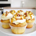 - 1 can (16 oz) refrigerated cinnamon roll dough - 1 medium Granny Smith apple, peeled and diced - 1/2 cup caramel sauce, plus extra for drizzling - 1/4 cup packed brown sugar - 1 teaspoon ground cinnamon - 1/2 cup chopped pecans (optional) - Cream cheese frosting (store-bought or homemade) These ingredients come together to make a delightful treat. The cinnamon roll dough gives a soft and fluffy base. The Granny Smith apple adds a tart crunch, which balances the sweetness of the caramel and brown sugar. Ground cinnamon gives warmth, while pecans add a nice crunch if you choose to include them. For top-notch results, I recommend using high-quality caramel sauce. Look for brands that use real sugar and cream. For the cream cheese frosting, I suggest a brand that is creamy and easy to spread. If you prefer homemade frosting, use full-fat cream cheese for a rich taste. If you can't find Granny Smith apples, other tart apples like Honeycrisp or Fuji work well. For a nut-free option, simply leave out the pecans. If you're short on caramel sauce, you can use chocolate sauce for a fun twist. You can also make your own caramel sauce by melting sugar, butter, and cream if you want to try a homemade version. First, preheat your oven to 350°F (175°C). This step is key to perfect cupcakes. Next, line a standard muffin tin with cupcake liners. This makes it easy to remove your cupcakes later. In a mixing bowl, add one medium Granny Smith apple, peeled and diced. Then, sprinkle in 1/4 cup of packed brown sugar and 1 teaspoon of ground cinnamon. If you love nuts, toss in 1/2 cup of chopped pecans. Stir it all together. Your apple filling will smell amazing! Open a can of refrigerated cinnamon roll dough. Cut each roll into quarters. Flatten each piece with your fingers. Spoon about a teaspoon of the apple filling into the center. Wrap the dough around the filling to form a ball. Place each ball in the muffin tin, filling each cup halfway. Drizzle some caramel sauce on top for extra flavor. Bake for 15-20 minutes until golden brown. A toothpick should come out clean when done. After baking, let the cupcakes cool in the tin for 5 minutes. Then, move them to a wire rack to cool fully. Once cool, frost each cupcake with cream cheese frosting. For a special touch, drizzle more caramel sauce on top right before serving. This adds a delicious finish to your delightful treats! To make the best caramel apple cinnamon roll cupcakes, start with the right oven temperature. Always preheat your oven to 350°F (175°C) for even baking. Use quality cinnamon roll dough for rich flavor. Make sure you cut the dough into equal quarters. This helps ensure they cook evenly. When filling, avoid overstuffing. Too much filling can cause spills. You can use store-bought cream cheese frosting for ease. If you want to make it from scratch, mix 8 ounces of softened cream cheese with 1/2 cup of butter. Add 2 cups of powdered sugar and 1 teaspoon of vanilla extract. Beat until smooth and creamy. This frosting pairs well with the sweet cupcakes. Presentation matters when serving these cupcakes. Use a decorative platter to showcase them. Drizzle extra caramel sauce over the frosted cupcakes. Add a sprinkle of chopped pecans for texture. This not only makes them look great but also adds flavor. Enjoy your beautiful and tasty treats! {{image_4}} You can get creative with other fillings. Try using berries like blueberries or strawberries. They give a nice tartness that pairs well with the sweet dough. You can also use chocolate chips for a rich taste. Mix in some nuts or dried fruits for added texture. Each option brings a new twist to the classic recipe. For a gluten-free version, look for gluten-free cinnamon roll dough. Many brands offer great taste and texture. You can also make your own dough using gluten-free flour. Just ensure all other ingredients are gluten-free too. This way, everyone can enjoy the cupcakes without worry. To make these cupcakes vegan, replace the cinnamon roll dough with a plant-based version. You can also use flax eggs instead of regular eggs. For the cream cheese frosting, choose a vegan brand or make one with vegan cream cheese. These changes keep the flavors rich while being plant-friendly. To store any leftover cupcakes, first let them cool completely. Place them in an airtight container. This keeps them fresh and moist. You can store them at room temperature for up to three days. If you want them to last longer, put them in the fridge. They can stay good for about a week in the fridge. Just remember to bring them back to room temperature before eating. If you want to freeze the cupcakes, start by letting them cool. Wrap each cupcake tightly in plastic wrap. Then, place the wrapped cupcakes in a freezer-safe bag or container. Make sure to remove as much air as possible. These cupcakes can last up to three months in the freezer. When you’re ready to eat them, move them to the fridge overnight. This helps them thaw gently. To reheat your cupcakes, use either an oven or microwave. If using an oven, preheat it to 350°F (175°C). Place the cupcakes on a baking sheet for 5-10 minutes. This warms them up without drying them out. If you’re in a hurry, use the microwave. Heat each cupcake for about 10-15 seconds. Be careful not to overheat, as it can make them tough. Enjoy your warm, tasty treat! These cupcakes stay fresh for about three days. Store them in an airtight container. If you want them to last longer, keep them in the fridge. This helps keep the cream cheese frosting cool and safe. Yes, you can use other apple types. Honeycrisp and Fuji apples add nice sweetness. Just make sure to peel and dice them the same way as Granny Smith apples. This keeps the texture right in the cupcakes. If you don't have pecans, walnuts work well too. You can also skip the nuts if you prefer. The cupcakes will still taste great without them. Just keep the apple filling as is for a yummy treat. Yes, you can make these cupcakes ahead of time. Bake them and let them cool completely. Then, store them in the fridge for up to two days. Frost them just before serving for the best taste and look. In this post, we explored how to make delicious apple cupcakes. We reviewed ingredients, tips, and variations. I shared step-by-step instructions to guide you through the baking process. Remember, perfecting your cupcakes takes practice and creativity. Try different fillings and frostings to find your favorite. With the right care, your cupcakes will impress any guest. Enjoy baking and sharing these tasty treats!