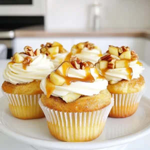 - 1 can (16 oz) refrigerated cinnamon roll dough - 1 medium Granny Smith apple, peeled and diced - 1/2 cup caramel sauce, plus extra for drizzling - 1/4 cup packed brown sugar - 1 teaspoon ground cinnamon - 1/2 cup chopped pecans (optional) - Cream cheese frosting (store-bought or homemade) These ingredients come together to make a delightful treat. The cinnamon roll dough gives a soft and fluffy base. The Granny Smith apple adds a tart crunch, which balances the sweetness of the caramel and brown sugar. Ground cinnamon gives warmth, while pecans add a nice crunch if you choose to include them. For top-notch results, I recommend using high-quality caramel sauce. Look for brands that use real sugar and cream. For the cream cheese frosting, I suggest a brand that is creamy and easy to spread. If you prefer homemade frosting, use full-fat cream cheese for a rich taste. If you can't find Granny Smith apples, other tart apples like Honeycrisp or Fuji work well. For a nut-free option, simply leave out the pecans. If you're short on caramel sauce, you can use chocolate sauce for a fun twist. You can also make your own caramel sauce by melting sugar, butter, and cream if you want to try a homemade version. First, preheat your oven to 350°F (175°C). This step is key to perfect cupcakes. Next, line a standard muffin tin with cupcake liners. This makes it easy to remove your cupcakes later. In a mixing bowl, add one medium Granny Smith apple, peeled and diced. Then, sprinkle in 1/4 cup of packed brown sugar and 1 teaspoon of ground cinnamon. If you love nuts, toss in 1/2 cup of chopped pecans. Stir it all together. Your apple filling will smell amazing! Open a can of refrigerated cinnamon roll dough. Cut each roll into quarters. Flatten each piece with your fingers. Spoon about a teaspoon of the apple filling into the center. Wrap the dough around the filling to form a ball. Place each ball in the muffin tin, filling each cup halfway. Drizzle some caramel sauce on top for extra flavor. Bake for 15-20 minutes until golden brown. A toothpick should come out clean when done. After baking, let the cupcakes cool in the tin for 5 minutes. Then, move them to a wire rack to cool fully. Once cool, frost each cupcake with cream cheese frosting. For a special touch, drizzle more caramel sauce on top right before serving. This adds a delicious finish to your delightful treats! To make the best caramel apple cinnamon roll cupcakes, start with the right oven temperature. Always preheat your oven to 350°F (175°C) for even baking. Use quality cinnamon roll dough for rich flavor. Make sure you cut the dough into equal quarters. This helps ensure they cook evenly. When filling, avoid overstuffing. Too much filling can cause spills. You can use store-bought cream cheese frosting for ease. If you want to make it from scratch, mix 8 ounces of softened cream cheese with 1/2 cup of butter. Add 2 cups of powdered sugar and 1 teaspoon of vanilla extract. Beat until smooth and creamy. This frosting pairs well with the sweet cupcakes. Presentation matters when serving these cupcakes. Use a decorative platter to showcase them. Drizzle extra caramel sauce over the frosted cupcakes. Add a sprinkle of chopped pecans for texture. This not only makes them look great but also adds flavor. Enjoy your beautiful and tasty treats! {{image_4}} You can get creative with other fillings. Try using berries like blueberries or strawberries. They give a nice tartness that pairs well with the sweet dough. You can also use chocolate chips for a rich taste. Mix in some nuts or dried fruits for added texture. Each option brings a new twist to the classic recipe. For a gluten-free version, look for gluten-free cinnamon roll dough. Many brands offer great taste and texture. You can also make your own dough using gluten-free flour. Just ensure all other ingredients are gluten-free too. This way, everyone can enjoy the cupcakes without worry. To make these cupcakes vegan, replace the cinnamon roll dough with a plant-based version. You can also use flax eggs instead of regular eggs. For the cream cheese frosting, choose a vegan brand or make one with vegan cream cheese. These changes keep the flavors rich while being plant-friendly. To store any leftover cupcakes, first let them cool completely. Place them in an airtight container. This keeps them fresh and moist. You can store them at room temperature for up to three days. If you want them to last longer, put them in the fridge. They can stay good for about a week in the fridge. Just remember to bring them back to room temperature before eating. If you want to freeze the cupcakes, start by letting them cool. Wrap each cupcake tightly in plastic wrap. Then, place the wrapped cupcakes in a freezer-safe bag or container. Make sure to remove as much air as possible. These cupcakes can last up to three months in the freezer. When you’re ready to eat them, move them to the fridge overnight. This helps them thaw gently. To reheat your cupcakes, use either an oven or microwave. If using an oven, preheat it to 350°F (175°C). Place the cupcakes on a baking sheet for 5-10 minutes. This warms them up without drying them out. If you’re in a hurry, use the microwave. Heat each cupcake for about 10-15 seconds. Be careful not to overheat, as it can make them tough. Enjoy your warm, tasty treat! These cupcakes stay fresh for about three days. Store them in an airtight container. If you want them to last longer, keep them in the fridge. This helps keep the cream cheese frosting cool and safe. Yes, you can use other apple types. Honeycrisp and Fuji apples add nice sweetness. Just make sure to peel and dice them the same way as Granny Smith apples. This keeps the texture right in the cupcakes. If you don't have pecans, walnuts work well too. You can also skip the nuts if you prefer. The cupcakes will still taste great without them. Just keep the apple filling as is for a yummy treat. Yes, you can make these cupcakes ahead of time. Bake them and let them cool completely. Then, store them in the fridge for up to two days. Frost them just before serving for the best taste and look. In this post, we explored how to make delicious apple cupcakes. We reviewed ingredients, tips, and variations. I shared step-by-step instructions to guide you through the baking process. Remember, perfecting your cupcakes takes practice and creativity. Try different fillings and frostings to find your favorite. With the right care, your cupcakes will impress any guest. Enjoy baking and sharing these tasty treats!