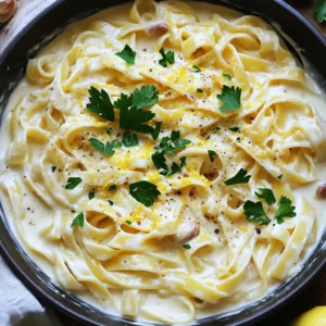 - 12 oz fettuccine pasta - 1 bulb of garlic - 2 tablespoons olive oil - 3 cups vegetable broth - 1 cup heavy cream - 1 cup grated Parmesan cheese - Salt and black pepper to taste - Fresh parsley, chopped (for garnish) - 1 teaspoon Italian seasoning - Zest of 1 lemon (optional for brightness) For this One-Pot Creamy Roasted Garlic Alfredo Pasta, you need simple ingredients. Each one plays a key role in making the dish flavorful and creamy. First, you have fettuccine pasta. It gives a nice, thick bite to the dish. Then, the bulb of garlic brings a rich, sweet flavor. Roasting the garlic changes its taste and makes it soft. The olive oil adds a nice, smooth texture. Next, the vegetable broth acts as our cooking liquid. It is a great way to add flavor without using meat. Heavy cream makes the sauce rich and creamy, while the grated Parmesan cheese adds a salty, cheesy kick. Salt and black pepper make sure to season the dish just right. Don’t forget the fresh parsley for a pop of color! The Italian seasoning gives the dish a nice herb flavor. Lastly, the lemon zest is optional but adds a bright touch. Each ingredient works together to create a dish that is not only tasty but also easy to make in one pot. Enjoy gathering these ingredients to start your cooking adventure! - Preheat your oven to 400°F (200°C). - Slice the top off the bulb of garlic. - Drizzle 1 tablespoon of olive oil over the bulb. - Wrap the garlic tightly in aluminum foil. - Roast for 30 to 35 minutes until the cloves are soft. Roasting garlic makes it sweet and rich. The warm smell fills your kitchen. You want it soft and caramelized for great flavor. - In a large pot, heat 1 tablespoon of olive oil over medium heat. - Add 3 cups of vegetable broth and 1 cup of heavy cream. - Mix in 1 teaspoon of Italian seasoning. - Stir well and bring to a gentle simmer. This sauce base is key for a creamy texture. The broth adds depth, while the cream makes it rich. - Add 12 oz of fettuccine pasta to the sauce. - Stir to make sure the pasta is well mixed. - Cook for 10 to 12 minutes, stirring often, until al dente. Cooking the pasta in the sauce lets it absorb the flavors. Al dente means it has a slight bite, which is perfect for this dish. - Remove the roasted garlic from the oven. - Let it cool for a few minutes. - Squeeze the soft garlic cloves into a bowl. - Use a fork to mash the cloves until smooth. Mashing the garlic gives it a creamy consistency. This adds a wonderful sweetness to the dish. - Lower the heat to low after cooking the pasta. - Stir in 1 cup of grated Parmesan cheese and the mashed garlic. - Mix until the cheese melts and the sauce is creamy. - Taste and season with salt, black pepper, and lemon zest as desired. Combining all these ingredients makes the dish sing! The cheese adds a salty kick, while the garlic brings warmth. - Remove the pot from the heat. - Let the sauce thicken for a couple of minutes. - Serve hot, garnished with fresh parsley and extra Parmesan. This final step makes the pasta even creamier. The garnish adds a pop of color and freshness. Enjoy your delicious creation! - To make sure your sauce is creamy, use heavy cream. - Stir the sauce well as you add the cheese to melt it fully. - Taste your sauce before serving. Add salt and pepper as needed. - Cook the pasta until it is al dente. This means it should be firm but not hard. - Stir the pasta often while it cooks. This helps it cook evenly and prevents sticking. - You can swap fettuccine for any long pasta like spaghetti or linguine. - For a dairy-free option, use coconut milk or a nut-based cream. It adds a nice flavor! {{image_4}} You can easily boost your One-Pot Creamy Roasted Garlic Alfredo Pasta with some protein. - Grilled chicken or shrimp: Adding grilled chicken or shrimp gives a nice flavor and texture. Simply grill your choice, cut it into pieces, and stir it in when you mix in the cheese and garlic. - Vegetarian protein options: If you prefer a meatless dish, try adding chickpeas or lentils. They pack protein and blend well with the creamy sauce. Adding vegetables makes the dish more colorful and healthy. - Spinach, mushrooms, or peas: Spinach wilts nicely and adds a fresh taste. Mushrooms bring a savory depth. Peas add little bursts of sweetness. Toss any of these in with the pasta near the end of cooking. - Seasonal vegetable suggestions: Use seasonal favorites like zucchini in summer or butternut squash in fall. These can enhance the dish and make it even more delicious. You can elevate the flavors of your pasta with some simple enhancements. - Extra herbs and spices: Fresh basil or thyme can add a lovely aroma. A pinch of red pepper flakes can give it a nice kick. - Lemon or truffle oil options: A splash of lemon juice brightens the dish and balances the cream. Truffle oil adds a rich, earthy flavor. Just a drizzle makes a big difference! To keep your One-Pot Creamy Roasted Garlic Alfredo Pasta fresh, cool it first. Once it cools, place it in an airtight container. This helps seal in the flavor and keeps out air. Store it in the fridge for up to three days. If you want to save it longer, freezing is a great option. When it's time to enjoy the leftovers, the best way to reheat is gently. You can use the stove or microwave. If using the stove, add a splash of vegetable broth or cream to the pot. Stir often over low heat. This helps keep the sauce creamy and prevents it from drying out. If using the microwave, heat in short bursts. Stir between each burst to ensure even heating. To freeze your pasta, start by letting it cool completely. Then, portion it into smaller containers. This makes it easier to thaw just what you need. Seal the containers tightly and label them with the date. You can freeze it for up to three months. When ready to eat, thaw it overnight in the fridge and reheat as mentioned above. Yes, you can use different types of pasta. I often use penne or rotini. Just adjust the cooking time as needed based on the pasta shape. Make sure it cooks until al dente. This helps the sauce stick better. The garlic is ready when it feels soft to the touch. You can also smell its sweet aroma. If it looks golden brown, that’s a good sign! Let it cool before you mash it. Absolutely! For a vegan version, swap heavy cream with coconut milk or cashew cream. Use vegan cheese or nutritional yeast in place of Parmesan. This keeps the dish creamy and tasty. The pasta stays good for about 3 to 5 days in the fridge. Store it in an airtight container. Before serving, reheat gently on the stove or in the microwave. Yes, you can prepare this dish ahead of time. Just make the pasta and sauce, then store them separately. When ready to serve, reheat and mix them together. This way, you preserve the creamy texture. This blog post guides you through making a delicious fettuccine Alfredo. You learned essential ingredients and easy steps for roasting garlic, crafting the sauce, and cooking pasta. I shared tips for perfect texture, flavor variations, and storage advice. Take this knowledge and create a tasty meal that satisfies. With practice, this dish can become a favorite in your kitchen. Enjoy the cooking journey!