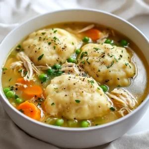 For a hearty chicken and dumplings soup, you need the following: - 2 tablespoons olive oil - 1 medium onion, finely chopped - 2 medium carrots, diced into small pieces - 2 celery stalks, diced - 3 cloves garlic, minced - 4 cups chicken broth (preferably low-sodium) - 2 cups cooked chicken, shredded or diced - 1 teaspoon dried thyme - 1/2 teaspoon freshly ground black pepper - 1 cup frozen peas - Salt, to taste - 1 1/2 cups all-purpose flour - 2 teaspoons baking powder - 1/2 teaspoon salt (for dumplings) - 1/4 cup whole milk - 1/4 cup fresh parsley, chopped (for garnish) Using fresh and quality ingredients makes a big difference. Choose bright, fresh vegetables. Look for chicken that is free-range or organic if you can. Low-sodium broth helps control salt in your dish. Fresh herbs like parsley add a burst of flavor. Feel free to add your twist! Try adding: - Corn for sweetness - Green beans for crunch - A splash of lemon juice for brightness - Herbs like rosemary or dill for more flavor You can also swap the chicken for turkey or use vegetable broth for a vegetarian twist. Each change will give a new taste while keeping it cozy. {{ingredient_image_2}} Start by heating 2 tablespoons of olive oil in a large pot over medium heat. Add the finely chopped onion, diced carrots, and diced celery. Sauté these veggies for about 5 to 7 minutes. You want them softened and the onion to be clear. Then, add 3 minced garlic cloves and cook for 1 to 2 more minutes. Keep stirring until the garlic smells good but does not brown. Next, pour in 4 cups of chicken broth and bring this mix to a gentle boil. Stir in 2 cups of shredded or diced cooked chicken, 1 teaspoon of dried thyme, and 1/2 teaspoon of black pepper. Add salt carefully, since the broth might be salty already. Lower the heat and let it simmer for 10 minutes to mix the flavors well. While your soup simmers, make the dumpling dough. In a medium bowl, whisk together 1 1/2 cups of all-purpose flour, 2 teaspoons of baking powder, and 1/2 teaspoon of salt. Slowly pour in 1/4 cup of whole milk while stirring. Mix just until you have a soft dough. Be careful not to overmix, or your dumplings could turn tough. To cook the dumplings, use a spoon to drop dollops of your dough into the simmering soup. Cover the pot with a lid and let the dumplings steam on top of the soup for about 15 minutes. Do not lift the lid during this time. This step is key for fluffy dumplings! After 15 minutes, gently stir in 1 cup of frozen peas. Let the soup cook for another 5 minutes to warm the peas and finish cooking the dumplings. Finally, taste the soup and add more salt or pepper if needed. Just before serving, mix in 1/4 cup of chopped fresh parsley for added flavor. To make your chicken and dumplings soup taste great, start with a good broth. I prefer low-sodium chicken broth. It lets you control the salt. Add fresh herbs like thyme and parsley. They bring in fresh flavors. Sauté your veggies well before adding broth. This step builds a rich base. For a deeper flavor, add a touch of garlic. Mince it finely and cook until fragrant. If your dumplings are dense, check your mixing method. Overmixing can lead to tough dumplings. Mix just until combined for a soft texture. If they sink in the soup, make sure your broth is simmering. You want them to steam properly. If your soup is too salty, add a bit more water or milk. This can balance the flavor. Stir in frozen peas last to keep them bright and fresh. For perfect chicken and dumplings, keep the soup at a gentle simmer. High heat can break down the dumplings. When you drop the dumpling dough, do it gently. Use a spoon to avoid splashing. Cover the pot while cooking the dumplings. This keeps the steam in and helps them rise. Lastly, taste the soup before serving. Adjust seasoning as needed for a well-balanced dish. Enjoy your warm, comforting bowl! Pro Tips Use Low-Sodium Broth: Opting for low-sodium chicken broth allows you to control the saltiness of your soup, ensuring it’s flavorful without being overpowering. Don’t Overmix Dumpling Dough: To achieve light and fluffy dumplings, mix the dough just until combined. Overmixing can lead to dense dumplings. Keep the Lid On: While the dumplings are cooking, avoid lifting the lid. This keeps the steam inside, which is essential for cooking the dumplings properly. Fresh Herbs for Garnish: Adding fresh parsley just before serving enhances the flavor and visual appeal of the soup, making it look even more inviting. {{image_4}} You can boost the nutrition of your Chicken and Dumplings Soup by adding more veggies. Some great choices include: - Green beans: Cut into small pieces. - Corn: Adds sweetness and color. - Spinach: Toss in fresh leaves at the end. - Zucchini: Chop into small cubes. Adding these veggies not only makes the soup healthier but also adds more flavor and texture. You can mix and match based on what you like or have on hand. If you want to spice things up, consider adding heat to your soup. Here are some ideas: - Cayenne pepper: Start with a pinch and adjust to taste. - Red pepper flakes: Sprinkle in during cooking. - Hot sauce: A few dashes can add nice heat. These options bring warmth to the dish. Adjust the spice level to suit your taste, and enjoy the kick! For a gluten-free option, you can easily swap out the all-purpose flour. Here are some alternatives: - Almond flour: Use the same amount. - Rice flour: This works well for dumplings. - Gluten-free all-purpose flour: Look for a blend that includes xanthan gum. Whichever flour you choose, follow the same dumpling steps. Your soup will still taste amazing and be safe for those avoiding gluten. To keep your Chicken and Dumplings Soup fresh, let it cool first. Use an airtight container to store it in the fridge. It will stay good for about 3 to 4 days. Make sure to label the container with the date. This way, you won’t lose track of how long it’s been there. When you are ready to enjoy your soup, pour it into a pot. Heat it on medium until it warms through. Stir occasionally to ensure even heating. If the soup seems thick, add a splash of chicken broth or water. This will help bring back the soup's creamy texture. You can freeze this soup too! Place it in a freezer-safe container. Leave some space at the top for expansion. It can last in the freezer for about 2 to 3 months. When you want to eat it, thaw it in the fridge overnight. Then reheat on the stove as mentioned above. To keep the dumplings fluffy, it’s best to freeze only the soup base. Prepare fresh dumplings when you're ready to serve. Yes, you can use raw chicken. Start by cooking it first in the pot. Sauté the raw pieces in olive oil until they brown. Then, add the onion, carrots, and celery. This adds great flavor to the soup. Cook the chicken through before adding broth and other ingredients. Just make sure the chicken reaches a safe temperature. You can use vegetable broth or water with seasoning. Both options work well. If you prefer a richer flavor, try using a mix of water and bouillon cubes. You can also make broth from scratch using bones or scraps. This adds depth to your soup. Remember to adjust the seasoning if you use low-sodium broth. To make fluffier dumplings, use the right amount of baking powder. This helps them rise. Mix the dough until just combined. Overmixing can make them tough. Also, ensure your milk is fresh and at room temperature. This helps with moisture. When you drop the dumpling mixture, avoid pressing it down in the soup. They need room to puff up while cooking. In this article, we explored the key ingredients for chicken and dumplings soup and how to choose the best ones. I shared step-by-step instructions for making the soup and dumplings, along with tips to enhance flavor and avoid common mistakes. We also looked at fun variations, proper storage, and answered common questions. Enjoy making this warm dish. It’s easy, tasty, and perfect for any meal. Happy cooking!