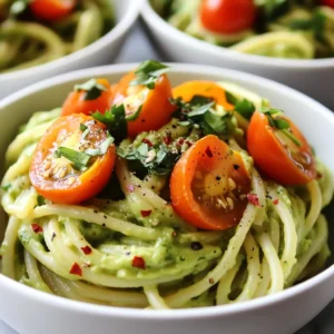- 12 oz of your favorite pasta (spaghetti or fettuccine are excellent choices) - 2 ripe avocados, pitted and peeled - 1 cup fresh cilantro leaves, tightly packed - 1 medium garlic clove, finely minced - 2 tablespoons freshly squeezed lime juice - 1/4 cup extra virgin olive oil - Salt and freshly cracked black pepper to taste - 1/4 teaspoon red pepper flakes (optional, for a hint of spice) - 1/4 cup freshly grated Parmesan cheese (optional, for a savory finish) - A handful of cherry tomatoes, halved (for garnish) Each ingredient plays a vital role in this dish. Avocados provide healthy fats, which are good for your heart. They also add creaminess without the need for heavy cream. Cilantro gives a fresh taste and contains antioxidants. Garlic boosts flavor and offers health benefits too. Lime juice adds brightness and balances the richness of the avocado. Olive oil brings healthy fats and enhances the dish's texture. Salt and pepper are crucial for seasoning, while red pepper flakes can add a fun kick. Lastly, Parmesan cheese adds a savory touch, making the dish more filling. If you can’t find certain ingredients, don’t worry! Here are some swaps you can try: - Use whole wheat or gluten-free pasta for a healthier option. - Swap cilantro with parsley if you dislike the flavor. - Lime juice can be replaced with lemon juice for a different zing. - Instead of Parmesan, try nutritional yeast for a vegan option. - For a nut-free sauce, skip the cheese and add a bit of tahini for creaminess. These substitutions ensure you can still enjoy this delicious meal, no matter what you have on hand! {{ingredient_image_2}} To start, bring a large pot of salted water to a boil. Use a good amount of salt; it helps flavor the pasta. Once the water boils, add 12 ounces of your favorite pasta, like spaghetti or fettuccine. Cook it according to the package instructions until it’s al dente. Before draining, save about 1 cup of the starchy water. This water helps the sauce stick later. Drain the pasta and set it aside, letting it cool a bit. Next, let’s make the creamy avocado sauce. In a blender or food processor, add 2 ripe avocados, 1 cup of fresh cilantro leaves, and 1 medium minced garlic clove. Also, add 2 tablespoons of lime juice, 1/4 cup of extra virgin olive oil, salt, and black pepper to taste. If you like a bit of heat, toss in 1/4 teaspoon of red pepper flakes. Blend everything until it’s smooth and creamy. Now, it’s time to put it all together. Return the drained pasta to the pot you cooked it in. Pour the creamy avocado sauce over the pasta. Toss it well to coat every strand evenly. If you want to add a savory touch, mix in 1/4 cup of freshly grated Parmesan cheese. Taste the dish and adjust the salt and pepper if needed. Serve the pasta right away, garnished with halved cherry tomatoes for color and flavor. Enjoy your vibrant, delicious meal! To make the sauce just right, start with ripe avocados. They should feel soft but not mushy. When blending, add olive oil and lime juice first. This helps the avocados blend smoothly. If your sauce seems thick, add a little pasta water. This water has starch, which helps make the sauce creamy. Blend until you see a velvety texture. To boost the flavor, use fresh cilantro. It adds a bright taste. Don’t skip the garlic; it brings a nice kick. For extra zest, add lime juice. If you like spice, include red pepper flakes. Lastly, if you want a savory touch, mix in Parmesan cheese. Always taste and adjust salt and pepper to your liking. You can make this dish ahead. Prepare the sauce and store it in the fridge. Just keep it in an airtight container. You can cook the pasta earlier too, but don’t mix them. When you’re ready to eat, warm the pasta gently and toss it with the sauce. This way, your dish stays fresh and tasty. Pro Tips Use Ripe Avocados: Ensure your avocados are perfectly ripe for the creamiest sauce. A ripe avocado will yield slightly to pressure and have a deep green color. Adjust for Creaminess: Don’t hesitate to adjust the consistency of the sauce with reserved pasta water until you achieve that silky texture you desire. Fresh Herbs Matter: Use fresh cilantro for the best flavor. If you're not a fan, try substituting with fresh basil or parsley for a different twist. Garnish Generously: Add extra cherry tomatoes and cilantro on top just before serving for a beautiful presentation and an additional flavor boost. {{image_4}} You can add protein to your creamy avocado cilantro pasta easily. Grilled chicken works great. Cook it simply with salt and pepper. Shrimp is another tasty choice. Sauté shrimp in olive oil until pink. For a plant-based option, try chickpeas. They add texture and protein. This pasta dish is already friendly for vegetarians. To make it vegan, skip the Parmesan cheese. You can use nutritional yeast instead. It gives a cheesy flavor without dairy. Always check your pasta for egg. Many brands offer vegan pasta options, making this dish accessible for everyone. If you love heat, add more red pepper flakes. This gives the dish a nice kick. You can also use jalapeños for a fresh spice. If you prefer no spice, simply leave it out. The creamy avocado sauce is still delicious without any heat. Adjust to suit your taste! You can store any leftover creamy avocado cilantro pasta in an airtight container. Make sure to cool it down first. It will stay fresh in the fridge for about 2-3 days. Use some extra lime juice to keep it bright and tasty. This helps the flavor and color last longer. If you want to freeze the pasta, it's best to do this before adding the sauce. Cook the pasta, drain it, and let it cool. Then, place it in a freezer-safe bag or container. You can freeze it for up to 2 months. When you're ready to enjoy it, just thaw it in the fridge overnight. To reheat the pasta, you have a couple of options. You can use the microwave or a stovetop. If using a microwave, place the pasta in a bowl, cover it, and heat in short bursts. Stir after each burst to warm evenly. On the stovetop, add a splash of water or olive oil to a pan. Heat over low until warm, stirring gently. If the pasta seems dry, add a little reserved pasta water or more sauce. This will help bring back its creamy texture. Yes, you can use many types of pasta. Spaghetti and fettuccine are my favorites. You can also try penne or farfalle. Just make sure it cooks well and holds the sauce. To make this dish dairy-free, skip the Parmesan cheese. The creamy avocado gives great flavor. You can also add nutritional yeast for a cheesy taste. It’s a great choice and still keeps the dish rich. This pasta dish is packed with healthy fats from avocados. Each serving has about: - Calories: 380 - Protein: 10 grams - Carbs: 40 grams - Fat: 22 grams These numbers can change based on your pasta choice and any added ingredients. This meal is a great source of nutrients and will keep you satisfied! This blog covered making a great pasta dish with avocado sauce. You learned about key ingredients and their benefits. We explored how to cook your pasta and prepare the sauce. You also discovered tips to enhance flavor and perfect the texture. Variations allow for exciting protein or spice options, too. Finally, we shared storage tips to keep leftovers fresh. Enjoying this dish can fit many diets and tastes. Now, go ahead and try it for yourself!