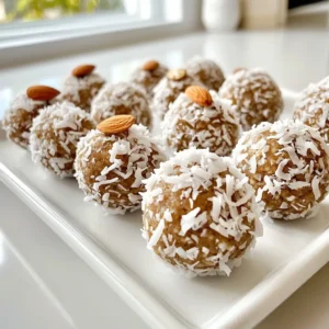 - 1 cup almond flour - 1/2 cup unsweetened shredded coconut - 1/4 cup raw honey or maple syrup - 1/4 cup almond butter - 1/2 teaspoon vanilla extract - 1/4 teaspoon fine sea salt - 1/3 cup dark chocolate chips (preferably dairy-free) - 1/4 cup whole almonds (for garnish) - 1 cup = 240 ml - 1/2 cup = 120 ml - 1/4 cup = 60 ml - 1/3 cup = 80 ml These conversions help you switch between cups and milliliters. They make measuring easy, no matter your tools! You can swap almond flour for oat flour if you like. For a nut-free option, use sunflower seed butter instead of almond butter. If you want a sweeter taste, try agave syrup in place of honey. You can also use semi-sweet chocolate chips if you prefer. These swaps keep the treat fun and tasty! {{ingredient_image_2}} Start by gathering your dry ingredients. In a large mixing bowl, add 1 cup of almond flour and 1/2 cup of unsweetened shredded coconut. Use a whisk or spoon to mix until they blend well. This step sets a solid base for your protein balls. Now, it’s time to make the wet mixture. To the dry mix, add 1/4 cup of raw honey or maple syrup, depending on your taste. Then, include 1/4 cup of almond butter, 1/2 teaspoon of vanilla extract, and 1/4 teaspoon of fine sea salt. Stir everything together with a spatula. You want a sticky, cohesive dough, so mix well until it all comes together. Once your dough is ready, take about 1 tablespoon of it and roll it into a ball using your hands. Place each ball on a parchment-lined baking sheet. For a touch of crunch and flair, press a whole almond into the top of each ball. This not only adds flavor but also makes them look great! After forming all the balls, transfer the baking sheet to the fridge. Let them chill for at least 30 minutes. Chilling them helps the flavors meld and makes the balls firmer. You’ll love how they taste once they're set! When making Almond Joy Protein Balls, be careful with the measurements. Too much almond flour can make them dry. Use a kitchen scale for accuracy. Also, avoid overmixing; this can lead to tough balls. Make sure to chill them long enough. This helps them firm up and enhances the taste. If they are too sticky, your hands might need a light dusting of almond flour. You can boost the flavors in your protein balls easily. Try adding a pinch of cinnamon or a dash of sea salt. Both can enhance the sweetness. If you like more chocolate, increase the dark chocolate chips. For a coconut twist, add a bit more shredded coconut. You can also use roasted almonds for more depth. Having the right tools makes the process smooth. Use a large mixing bowl for easy stirring. A spatula helps combine the ingredients well. A tablespoon scoop makes rolling the balls quick and uniform. Don’t forget parchment paper for easy cleanup! Lastly, a good fridge is key for chilling. This helps set the texture just right. Pro Tips Chill for Better Texture: Allowing the protein balls to chill for at least 30 minutes not only helps them firm up but also enhances the blending of flavors, resulting in a more delicious treat. Customize Your Sweetness: Adjust the sweetness to your liking by varying the amount of honey or maple syrup. You can also experiment with flavored nut butters for added taste. Mix-In Variations: Feel free to add your favorite mix-ins such as chopped dried fruits, seeds, or protein powder to create unique flavor combinations and boost nutritional value. Perfect Portioning: Use a cookie scoop or tablespoon for consistent sizing of your protein balls. This ensures even cooking and makes it easier to track serving sizes. {{image_4}} You can use honey or maple syrup in this recipe. Honey gives a richer taste. It adds a lovely sweetness. Maple syrup is a great vegan option. It has a different flavor and is still sweet. Try both to see which you like best! You can add fun mix-ins to your protein balls. Chopped nuts can boost the crunch. Try walnuts, pecans, or hazelnuts. Seeds like chia or flax can add nutrients. You can even add dried fruit for extra flavor. Just be sure not to overdo it, or the balls might not stick together. Want to make these protein balls vegan? Easy! Just swap honey for maple syrup. Use a nut butter without added sugars. Check the chocolate chips too; use dairy-free ones. This way, everyone can enjoy a tasty treat! To keep your Almond Joy Protein Balls fresh, place them in an airtight container. You can stack them in one layer or separate them with parchment paper. This helps prevent them from sticking together. Store the container in the fridge for best results. If you wish to store them for a longer time, freezing works great. Place the protein balls in a single layer on a baking sheet. Freeze them for about an hour. Then, transfer the balls to a freezer-safe bag or container. Don’t forget to label the bag with the date. They will last for up to three months in the freezer. When stored correctly in the fridge, protein balls can last for up to one week. Keep an eye on them for any signs of spoilage. If they start to look or smell off, it’s best to toss them. For the best taste and texture, enjoy them fresh or within a few days. Yes, you can use other nut butters. Peanut butter, cashew butter, or sunflower seed butter work well. Each will give a unique taste. The key is to keep the same amount. Using a different nut butter can change the flavor but still keep it tasty. To make Almond Joy Protein Balls gluten-free, use almond flour. It is naturally gluten-free and perfect for this recipe. Make sure any added ingredients, like chocolate chips, are also gluten-free. Always check labels to ensure no hidden gluten. Almond Joy Protein Balls have many benefits. They are rich in protein from almond flour and nut butter. The dark chocolate chips add antioxidants. Shredded coconut provides healthy fats and fiber. They are a balanced snack that fuels your body. Plus, they are low in refined sugars, making them a smart choice! In this post, we explored key ingredients and how to measure them. We walked through each step, from mixing dry and wet ingredients to creating and chilling your protein balls. I shared tips to avoid common mistakes and ways to enhance flavor. We also discussed ingredient variations and storage tips. Protein balls are fun to make and easy to enjoy. Tailor recipes to fit your taste and needs. With these tips, you can create delicious snacks that are healthy and satisfying. Enjoy making your own!