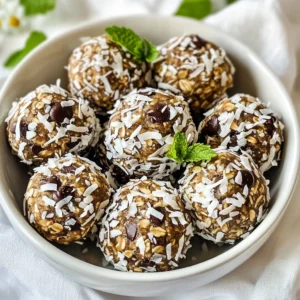 To make these tasty Mint Chocolate Chip Energy Bites, gather the following: - 1 cup rolled oats - 1/2 cup almond butter (or any nut/seed butter of your choice) - 1/4 cup honey or maple syrup (pure variety recommended) - 1/4 cup mini dark chocolate chips - 1/4 cup unsweetened shredded coconut - 1 teaspoon pure peppermint extract - 1 tablespoon chia seeds - A pinch of salt These ingredients blend to create a snack that is both fun and healthy. You can swap ingredients based on your taste or needs. If you don’t like almond butter, use peanut butter or sunflower seed butter. Maple syrup can replace honey for a vegan option. For a dairy-free choice, select dairy-free chocolate chips. If you want more crunch, add nuts like walnuts or pecans instead of coconut. Feel free to experiment and find what you enjoy most! - Rolled oats: High in fiber, oats help keep you full longer. They also provide energy. - Almond butter: This nut butter offers healthy fats and protein. It helps with muscle repair and growth. - Honey or maple syrup: Both natural sweeteners give quick energy. They are better than refined sugar. - Mini dark chocolate chips: Dark chocolate is rich in antioxidants and can boost your mood. - Unsweetened shredded coconut: It adds fiber and healthy fats. It can also support heart health. - Pure peppermint extract: Peppermint can aid digestion and add a fresh flavor. - Chia seeds: These tiny seeds are packed with omega-3 fats, fiber, and protein. They also help keep you hydrated. - A pinch of salt: This enhances the flavors and balances sweetness. Each ingredient brings unique benefits, making these bites a smart choice for a snack! {{ingredient_image_2}} To make mint chocolate chip energy bites, start by gathering your ingredients. In a large bowl, mix 1 cup of rolled oats, 1/2 cup of almond butter, and 1/4 cup of honey or maple syrup. Add 1 teaspoon of pure peppermint extract to give it that minty kick. Stir the mixture until it is well combined. You want it to be sticky yet smooth. This mix serves as the base for your bites. Now it's time to shape the mixture into bites. Use your hands to roll small balls, about 1 inch wide. If the mix sticks to your hands, dampen them slightly with water. This trick makes rolling easier. After forming the bites, place them on a parchment-lined baking sheet. Make sure they are spaced out well. Once you’ve shaped all the bites, place the baking sheet in the refrigerator. Chill them for at least 30 minutes. This step helps the energy bites firm up and hold their shape. After chilling, transfer them to an airtight container. Store them in the fridge, where they can stay fresh for up to one week. Enjoy these bites as a quick snack or a healthy treat anytime! When making Mint Chocolate Chip Energy Bites, avoid over-mixing. If you mix too much, the texture may become too dense. Also, be careful with the sweetener. Using too much honey or syrup can make them sticky and hard to roll. Lastly, don’t skip the chilling step. Chilling helps the bites hold their shape. To boost flavor, try adding a pinch of sea salt. This adds a nice contrast to the sweetness. You can also mix in some cocoa powder if you want a richer taste. For texture, consider adding chopped nuts or seeds. These add a delightful crunch. You can even roll the bites in shredded coconut for a fun twist. To make these bites vegan, swap honey for maple syrup. This keeps the sweetness while staying plant-based. For a nut-free option, use sunflower seed butter instead of almond butter. This keeps the creamy texture without nuts. You can also check that your chocolate chips are dairy-free. This way, everyone can enjoy these tasty treats! Pro Tips Use Fresh Mint: For an extra burst of flavor, consider adding finely chopped fresh mint leaves to the mixture. Chill for Longer: If you have time, let the energy bites chill for an hour or more to achieve an even firmer texture. Experiment with Sweeteners: Feel free to substitute honey with agave syrup or use a sugar-free sweetener for a lower-calorie option. Add Protein: Boost the nutritional value by mixing in a scoop of your favorite protein powder into the base mixture. {{image_4}} You can change the flavor of your mint chocolate chip energy bites. Adding cocoa powder gives a rich chocolate taste. Use 2 tablespoons of unsweetened cocoa powder. Mix it in with the oats and almond butter. You can also try adding vanilla extract for a warm touch. Just one teaspoon will add a lovely depth. Feel free to add nuts or seeds to boost nutrition. Chopped walnuts or almonds add a nice crunch. You can use sunflower seeds or pumpkin seeds if you want a nut-free option. Just a quarter cup will do. This will make your bites even more filling and tasty. Switch up the sweeteners for different flavors. If you want a lower-glycemic option, use agave syrup instead of honey. You can also use date syrup for a caramel-like taste. Just keep the amount the same as honey or maple syrup. This change keeps your bites sweet but adds a new twist. To keep your Mint Chocolate Chip Energy Bites fresh, use an airtight container. This helps prevent moisture and keeps them tasty. Store the bites in the refrigerator. If you want them to last longer, follow the freezing instructions below. Always make sure they are cooled down before storing. You can freeze these bites for up to three months. First, let them chill in the fridge. Then, place the energy bites in a single layer on a baking sheet. Freeze them for about an hour. Once frozen, transfer them to a freezer-safe bag or container. Label it with the date for easy reference when you want a snack! In the fridge, these bites last up to one week. If you freeze them, they stay good for about three months. Just thaw them in the fridge overnight before enjoying. This way, you always have a healthy snack ready to go! You can use any nut or seed butter. Peanut butter, cashew butter, or sunflower seed butter work well. Each option gives a unique flavor and texture. Choose the one you like best! These energy bites last up to one week in the fridge. Store them in an airtight container to keep them fresh. They make a great snack for busy days! Yes, you can use agave syrup instead of honey. It has a similar sweetness and will keep the bites moist. Just use the same amount, and you’re good to go! We explored how to make tasty energy bites from simple ingredients. You learned about each ingredient’s benefits and what substitutes you can use. I shared the steps to prepare, chill, and store your bites. We also covered tips to improve flavor and texture while avoiding common mistakes. Plus, I gave ideas for variations and proper storage methods. In conclusion, making energy bites is fun and easy. These snacks can fit your taste and needs, whether you want them vegan or nut-free. Enjoy crafting your perfect energy bite!