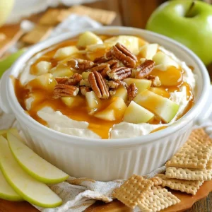 - 8 oz cream cheese, softened - 1 cup powdered sugar - 1/2 cup brown sugar - 1 teaspoon vanilla extract - 1/2 cup sour cream - 1 teaspoon ground cinnamon - 1 cup finely diced apples - 1/2 cup caramel sauce - 1/2 cup chopped pecans (optional) - Suggested serving items: apple slices and graham crackers The key to this dip is the blend of sweet and creamy flavors. I always start with cream cheese. It gives the dip a rich base. Make sure the cream cheese is softened. This helps it mix well. Next, I add powdered sugar and brown sugar. This mix adds sweetness and a hint of molasses flavor. Don’t forget the vanilla extract. It adds a nice touch of warmth. The sour cream gives a bit of tang, balancing the sweetness. I also add ground cinnamon. It adds a warm spice that makes everything better. Apples are a must. I like using Granny Smith or Honeycrisp for their crunch. The caramel sauce brings it all together. Drizzle it on top for a sweet finish. If you want some crunch, sprinkle chopped pecans on top. For serving, I suggest fresh apple slices and graham crackers. They are perfect for dipping into this tasty treat. This dip is fun and easy to make, and it always impresses guests! {{ingredient_image_2}} - First, take 8 oz of softened cream cheese. - Use a hand mixer to beat the cream cheese until smooth. - Gradually sift in 1 cup of powdered sugar. - Add 1/2 cup of packed brown sugar. - Mix on low speed until both sugars blend well. - Now, add 1 teaspoon of vanilla extract. - Next, pour in 1/2 cup of sour cream. - Beat the mixture on medium speed until creamy. - Sprinkle in 1 teaspoon of ground cinnamon. - Mix again on low speed until the cinnamon is even. - Gently fold in 1 cup of finely diced apples. - Spoon the cream cheese mixture into a serving dish. - Smooth the top with a spatula for a nice finish. - Drizzle 1/2 cup of caramel sauce over the dip. - Let the caramel cascade down the sides for looks. - Optionally, sprinkle 1/2 cup of chopped pecans on top. To make your dip super creamy, start with room temperature cream cheese. Cold cream cheese won't blend well. When you mix in the sugars, keep your mixer on low speed. This helps avoid a sugar cloud in your kitchen. For a stunning look, choose a clear bowl. It lets everyone see the yummy layers. Top the dip with fresh apple slices or a sprinkle of cinnamon. This adds extra color and flavor! This dip pairs well with a variety of fruits and crackers. You can serve it with juicy apple slices or crunchy graham crackers. It also works great on a dessert platter with other sweet treats. Everyone will love customizing their own bites! Pro Tips Use Room Temperature Cream Cheese: Make sure your cream cheese is at room temperature to ensure a smooth and creamy dip without lumps. Choose the Right Apples: For a perfect balance of sweetness and tartness, opt for Granny Smith or Honeycrisp apples in your dip. Customize with Toppings: Feel free to experiment with toppings like crushed pretzels or chocolate drizzle for added flavor and texture. Chill Before Serving: Let the dip chill in the refrigerator for about 30 minutes before serving to allow the flavors to meld together. {{image_4}} You can swap out sugar for honey or maple syrup. Both add a rich flavor. Honey gives a floral note, while maple syrup offers a warm taste. Just use less of these sweeteners than sugar. Start with half the amount and taste. Adjust as needed to reach your desired sweetness. Feel free to get creative with flavor. You can add chocolate chips for a sweet twist. Dark chocolate adds a nice contrast to the dip. Dried fruits like raisins or cranberries also work well. They offer extra sweetness and texture. Mix in a handful for added flavor. If you want a nut-free dip, swap pecans for sunflower seeds. Sunflower seeds give a nice crunch without nuts. They also add a bit of earthiness to the dip. Just chop them coarsely and sprinkle on top. This keeps your dish safe for those with nut allergies. To keep your Caramel Apple Cheesecake Dip fresh, refrigerate it in an airtight container. This prevents air from getting in and keeps the dip creamy. You should enjoy this dip within 3 days of making it. After that, the flavors can change, and the dip might not taste as good. Reheating is not recommended for this dip. It tastes best when served cold. Enjoy it straight from the fridge with fresh apple slices or graham crackers for dipping! Yes, it can be prepared a few hours in advance. This dip tastes great when chilled. Just cover it tightly and store it in the fridge. When you’re ready to serve, take it out and add the caramel sauce on top. This helps keep it fresh and delicious. You can use Greek yogurt or mascarpone as alternatives. Greek yogurt gives a tangy flavor and a creamy texture. Mascarpone is rich and smooth, adding a nice touch. Both options keep the dip tasty and enjoyable. Yes, you can make it vegan. Use vegan cream cheese and plant-based sour cream. These swaps allow everyone to enjoy the dip without dairy. The flavor remains rich and creamy, making it a hit at any gathering. You learned how to make a delicious Caramel Apple Cheesecake Dip. We discussed the right ingredients, simple steps, and helpful tips. Remember to store it well for the best taste. You can even customize it with different flavors or sweeteners. This dip is perfect for parties or snacking. Enjoy making it for friends and family—they will love it!